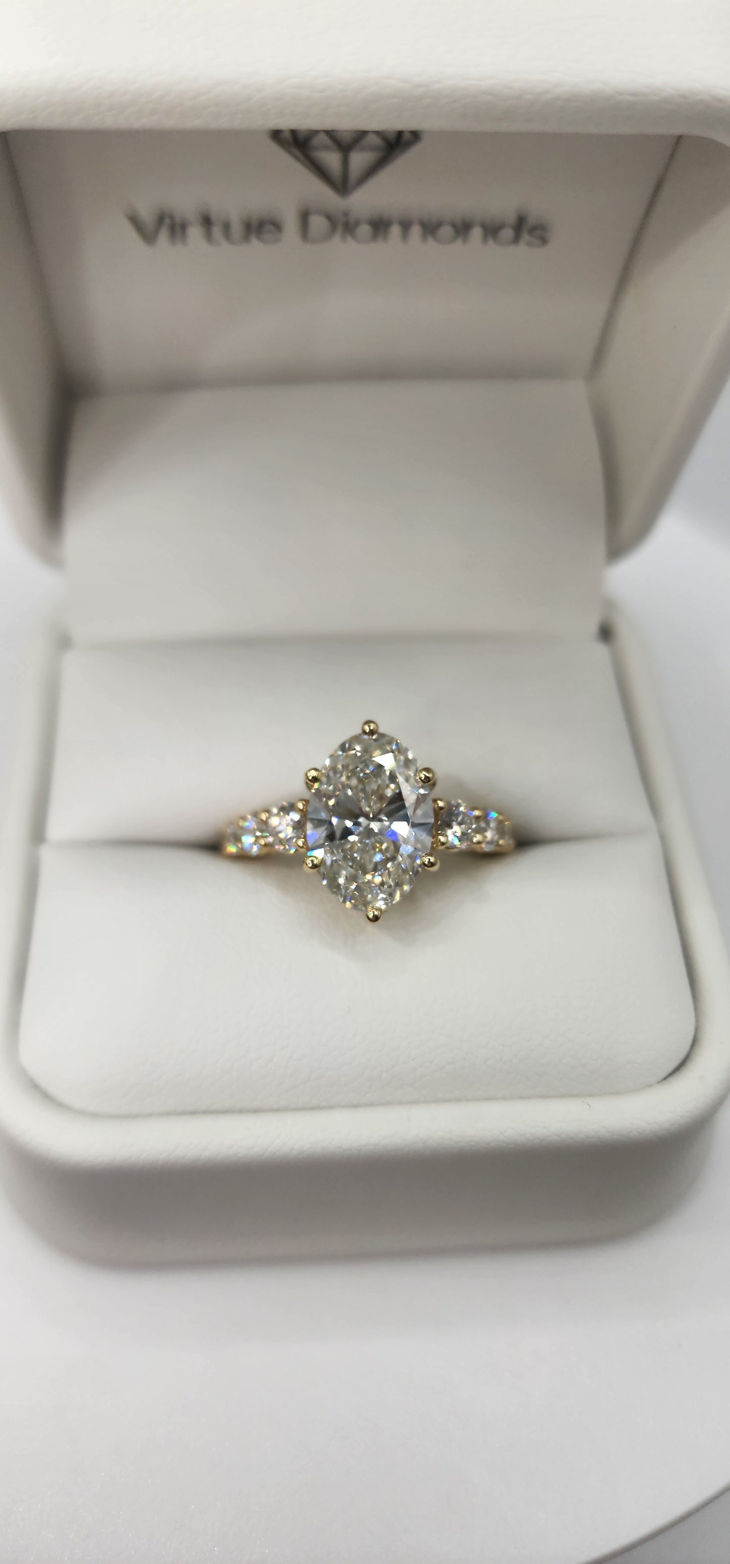 "The Cathy" 3 Carat Oval Lab Grown Diamond, G, VS1 set in 14k Yellow Gold Band with Round Accent Diamonds and Matching Curved Band
