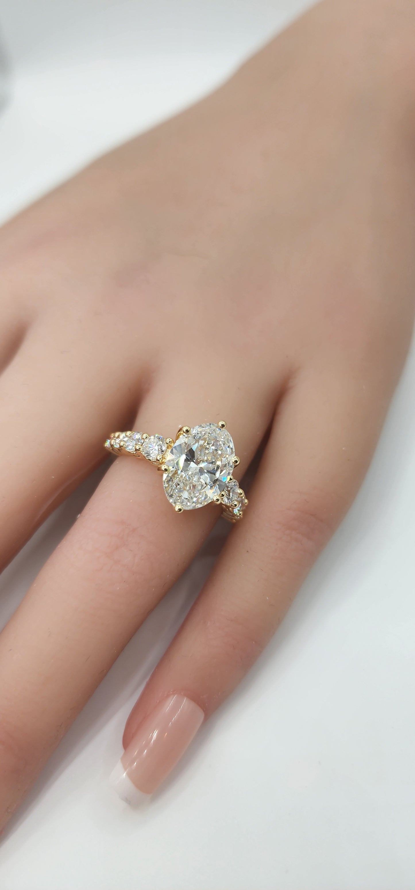 "The Cathy" 3 Carat Oval Lab Grown Diamond, G, VS1 set in 14k Yellow Gold Band with Round Accent Diamonds and Matching Curved Band