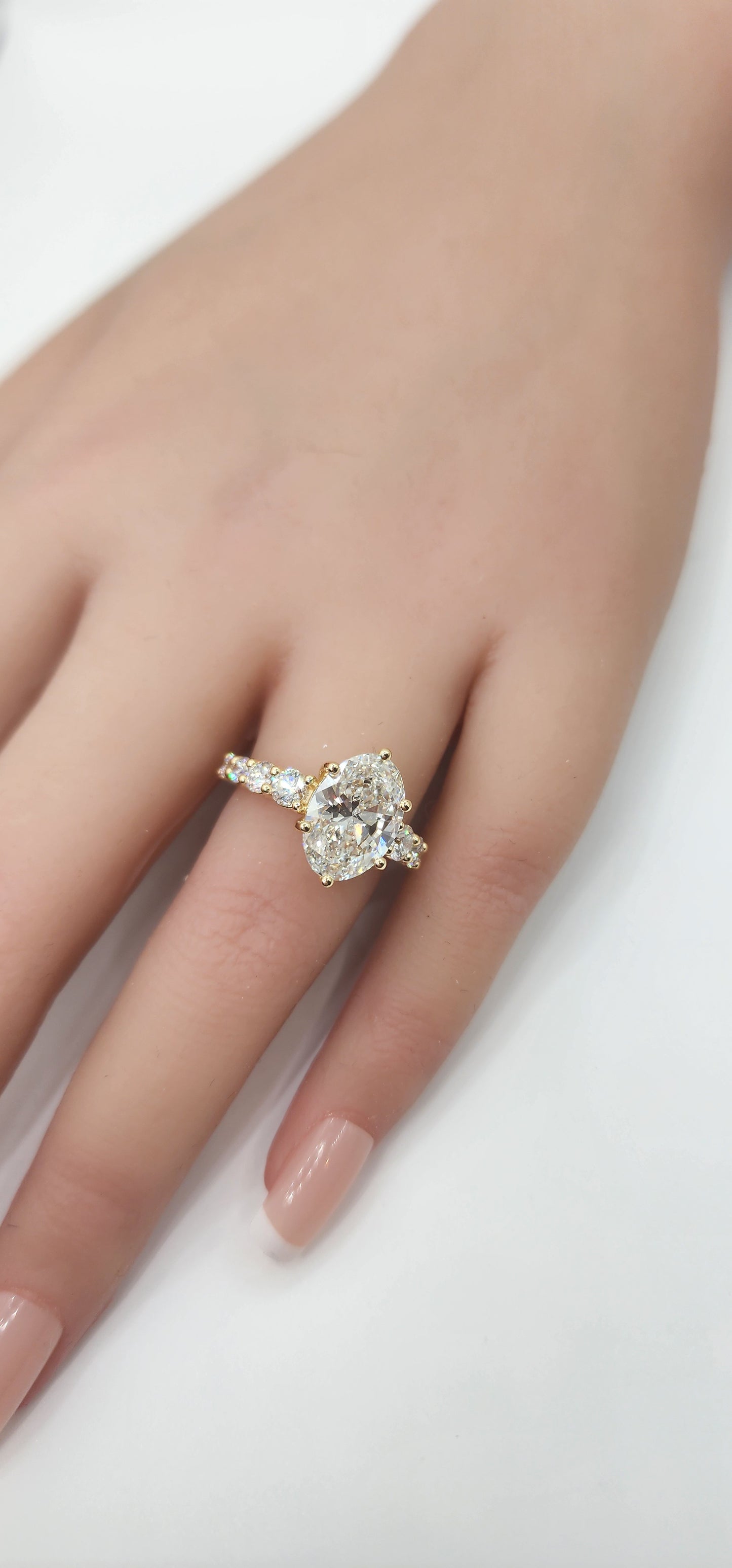 "The Cathy" 3 Carat Oval Lab Grown Diamond, G, VS1 set in 14k Yellow Gold Band with Round Accent Diamonds and Matching Curved Band