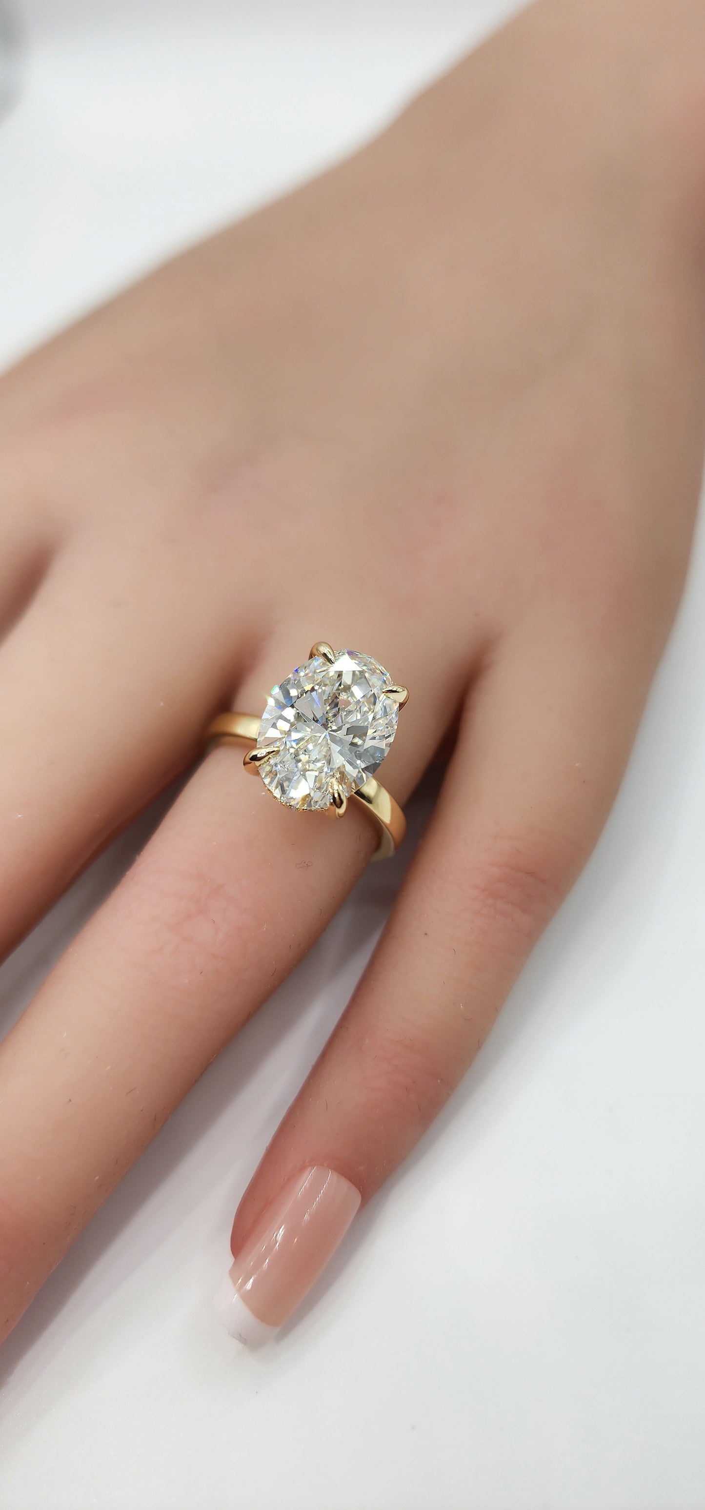 "The Kelli" 5.48 Carat Oval Lab Grown Diamond, G VS1 on a 14k Yellow Gold 1.8mm band with Hidden Halo and Yellow Gold Claw Prongs