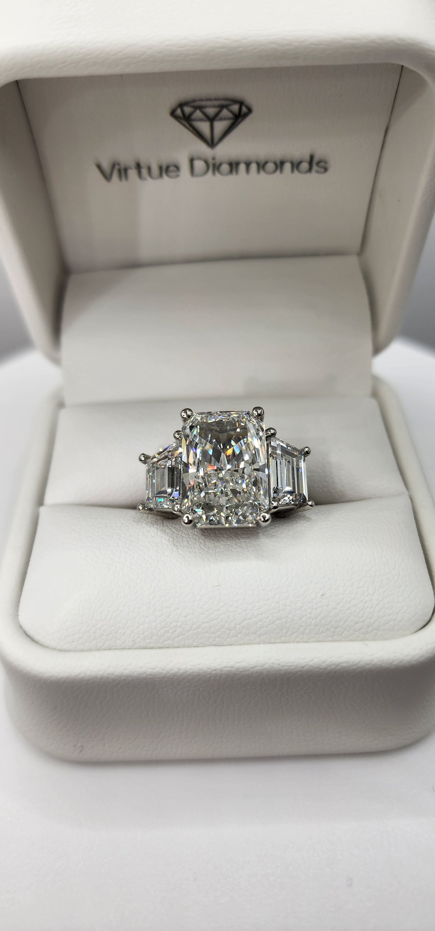 ""The Eliot" 8 Carat Radiant Cut & 1.5 Carat Trapezoids all E VVS2 Lab Grown Diamonds, set in Platinum