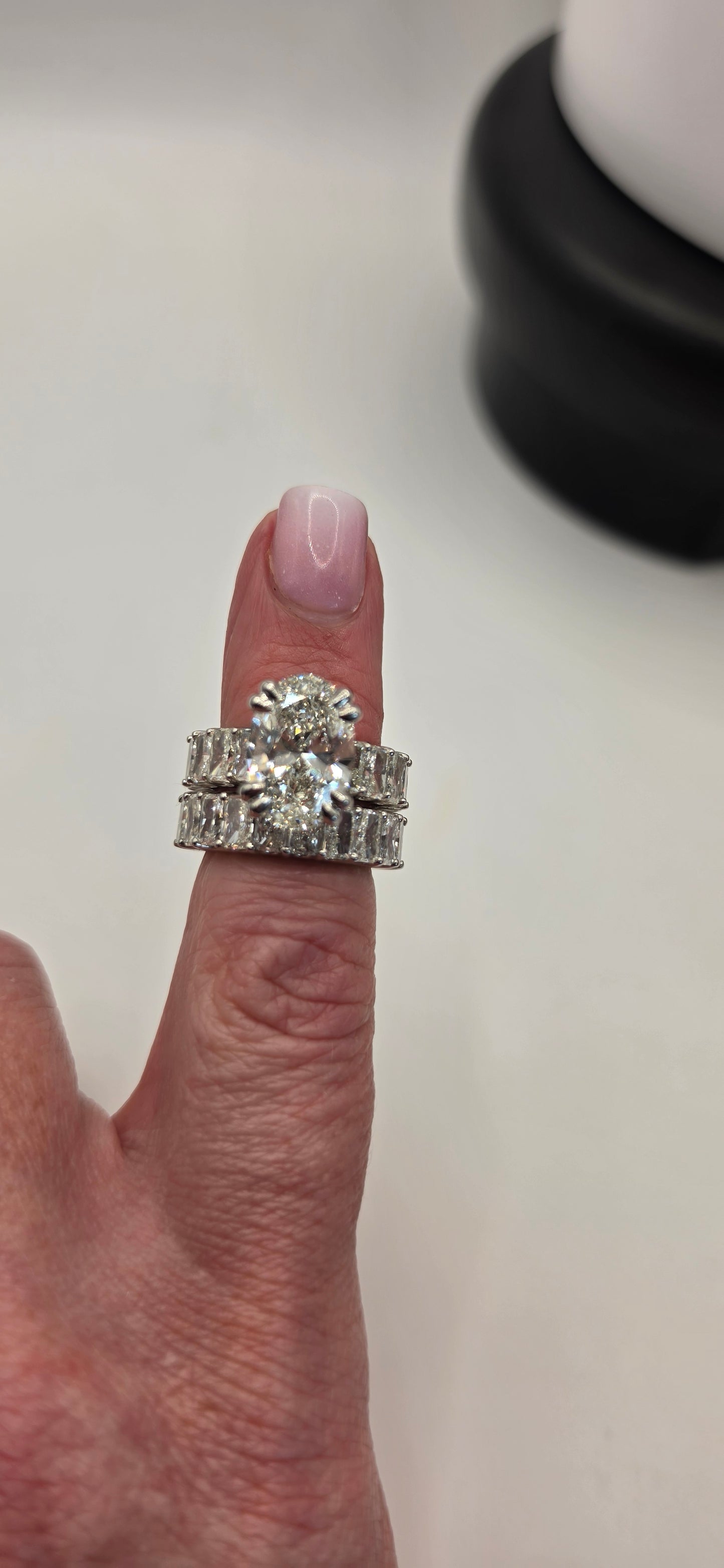 "The Heather" is a 5 Carat Oval Lab Grown Diamond Set in 2 Bands with Over 8 carats of Radiant Lab Diamonds