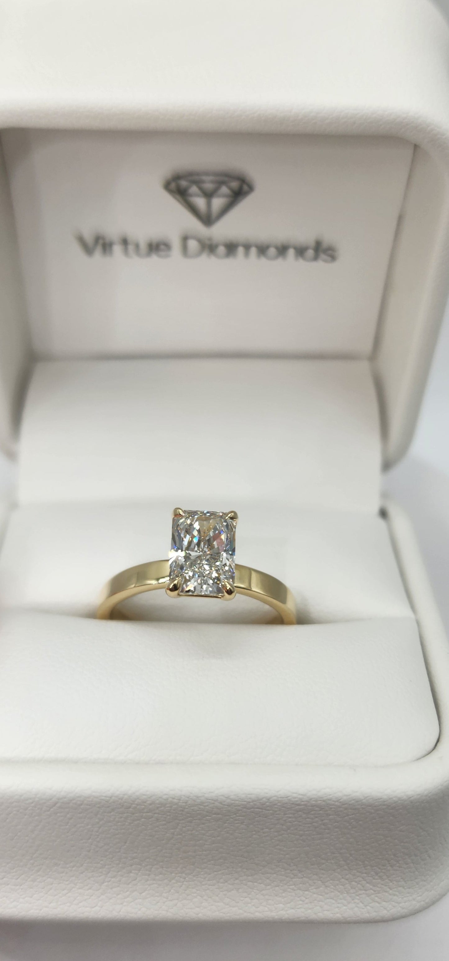 "The Cecilia", 2 Carat Radiant Lab Grown Diamond, H, VS1 on a 14k Yellow Gold 2.5mm Cigar Band