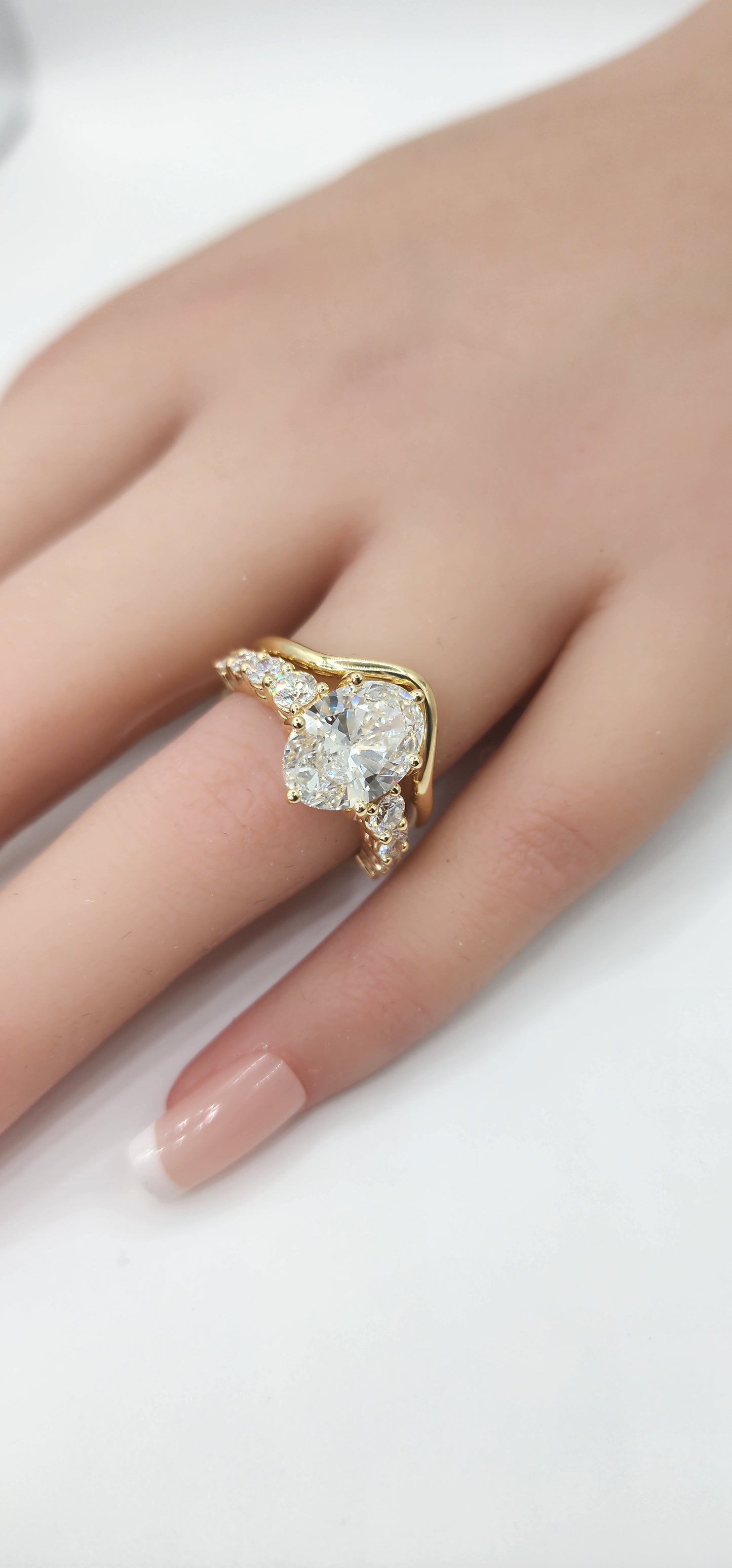"The Cathy" 3 Carat Oval Lab Grown Diamond, G, VS1 set in 14k Yellow Gold Band with Round Accent Diamonds and Matching Curved Band