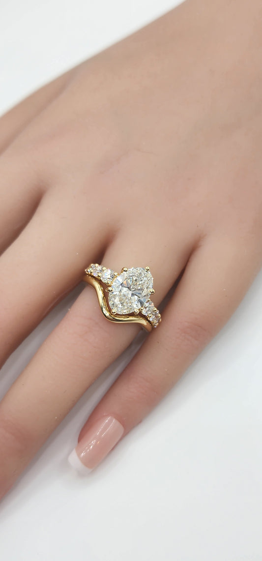 "The Cathy" 3 Carat Oval Lab Grown Diamond, G, VS1 set in 14k Yellow Gold Band with Round Accent Diamonds and Matching Curved Band