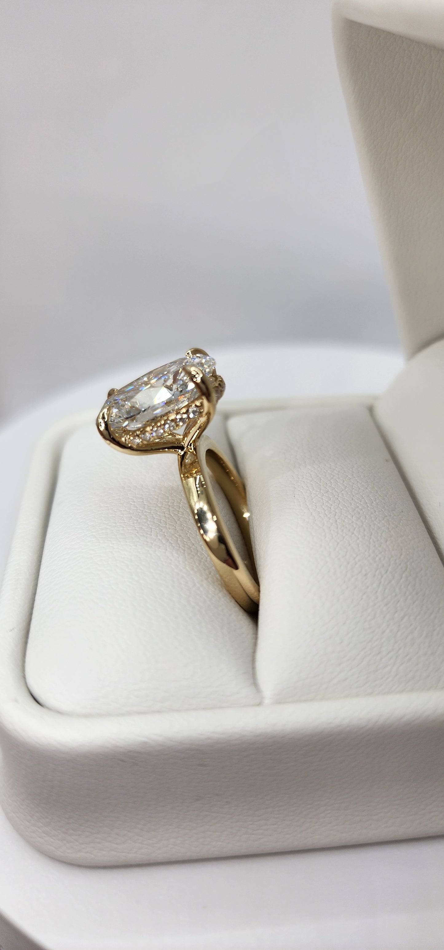 "The Kelli" 5.48 Carat Oval Lab Grown Diamond, G VS1 on a 14k Yellow Gold 1.8mm band with Hidden Halo and Yellow Gold Claw Prongs