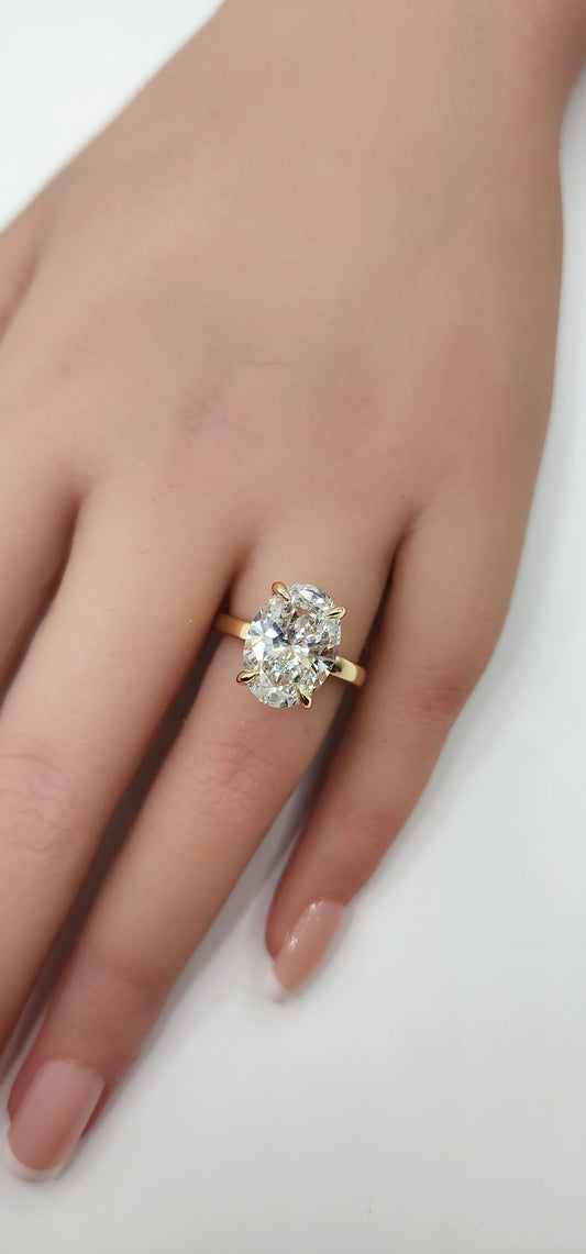 "The Kelli" 5.48 Carat Oval Lab Grown Diamond, G VS1 on a 14k Yellow Gold 1.8mm band with Hidden Halo and Yellow Gold Claw Prongs