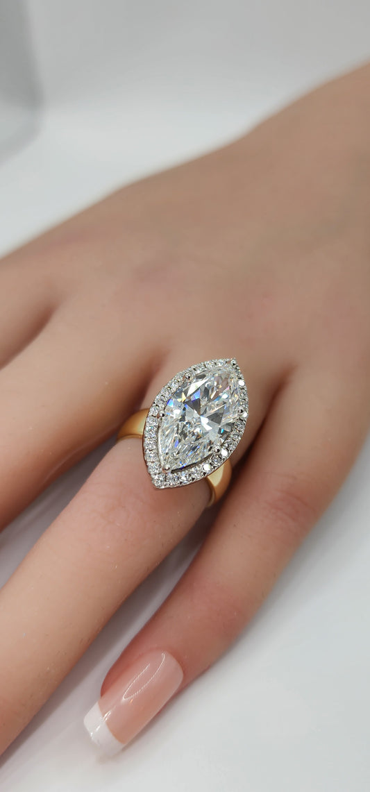 "The Hope" 5.5 Carat Marquise Lab Grown Diamond Set on a 5.5 mm 14k Yellow Gold Cigar Band, 14k White Gold Prongs and a Diamond Halo