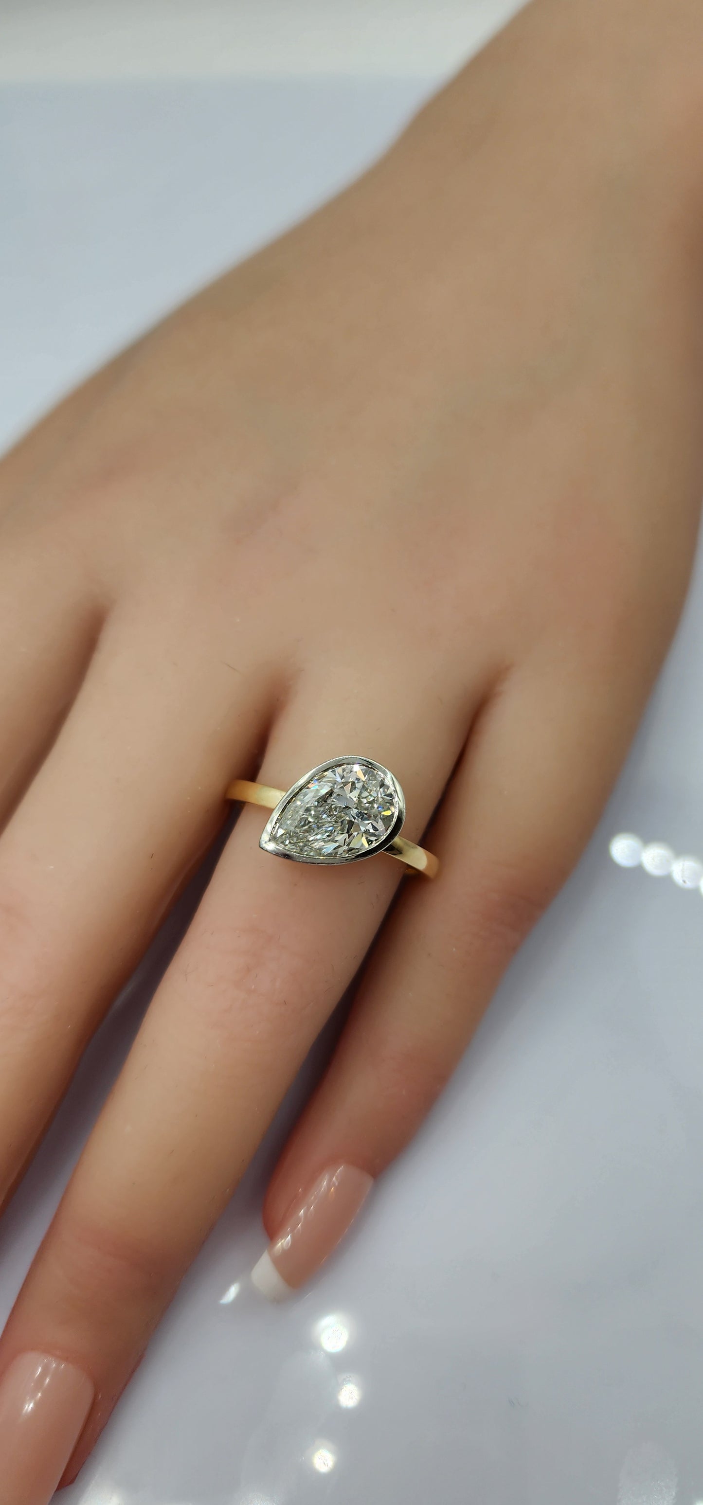 "The Kim Pear Bezel"  3 Carat Pear,  F, VS1 IGI Certified Lab Grown Diamond, set in a 14k White Gold Bezel Setting Head with a 14K Yellow Gold Band