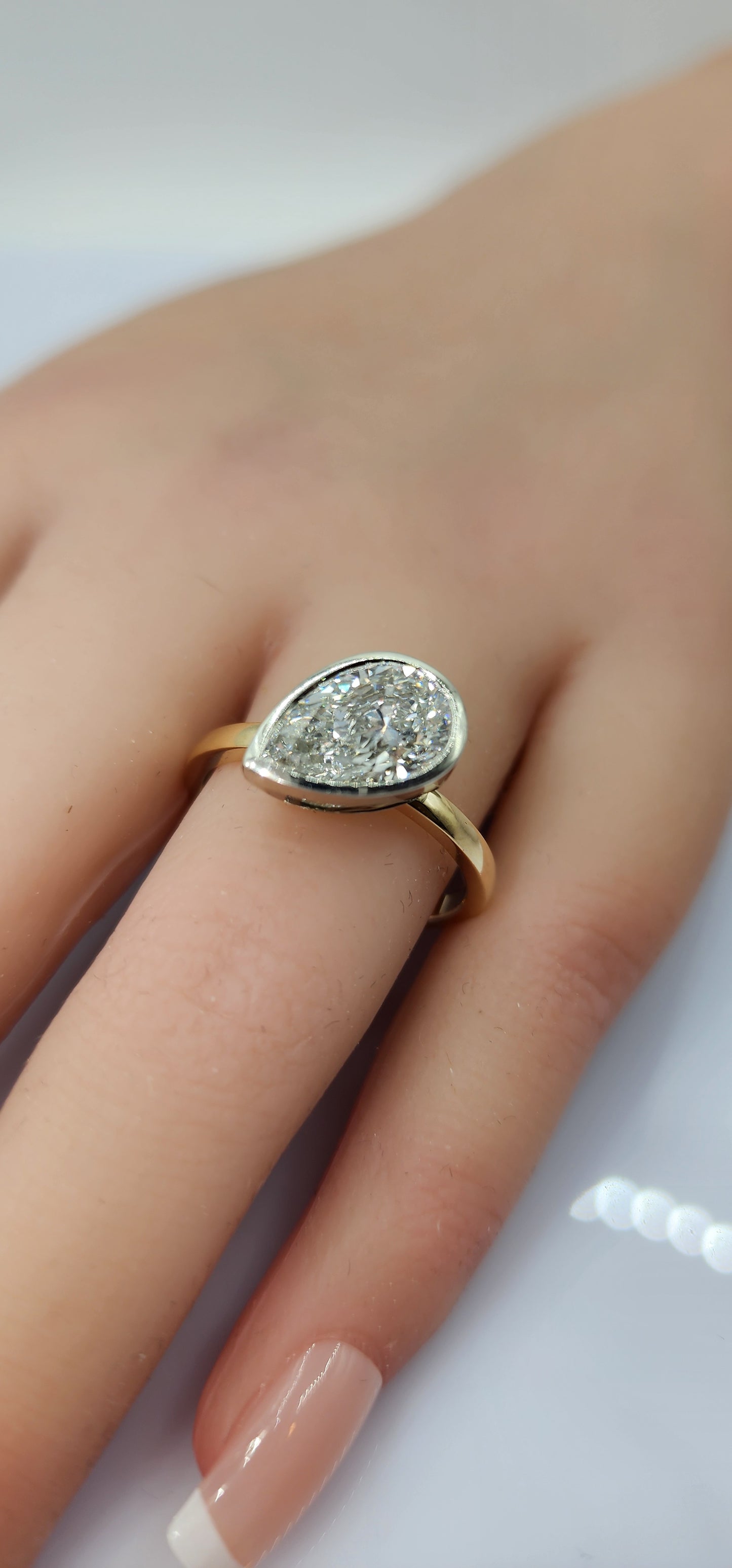 "The Kim Pear Bezel"  3 Carat Pear,  F, VS1 IGI Certified Lab Grown Diamond, set in a 14k White Gold Bezel Setting Head with a 14K Yellow Gold Band