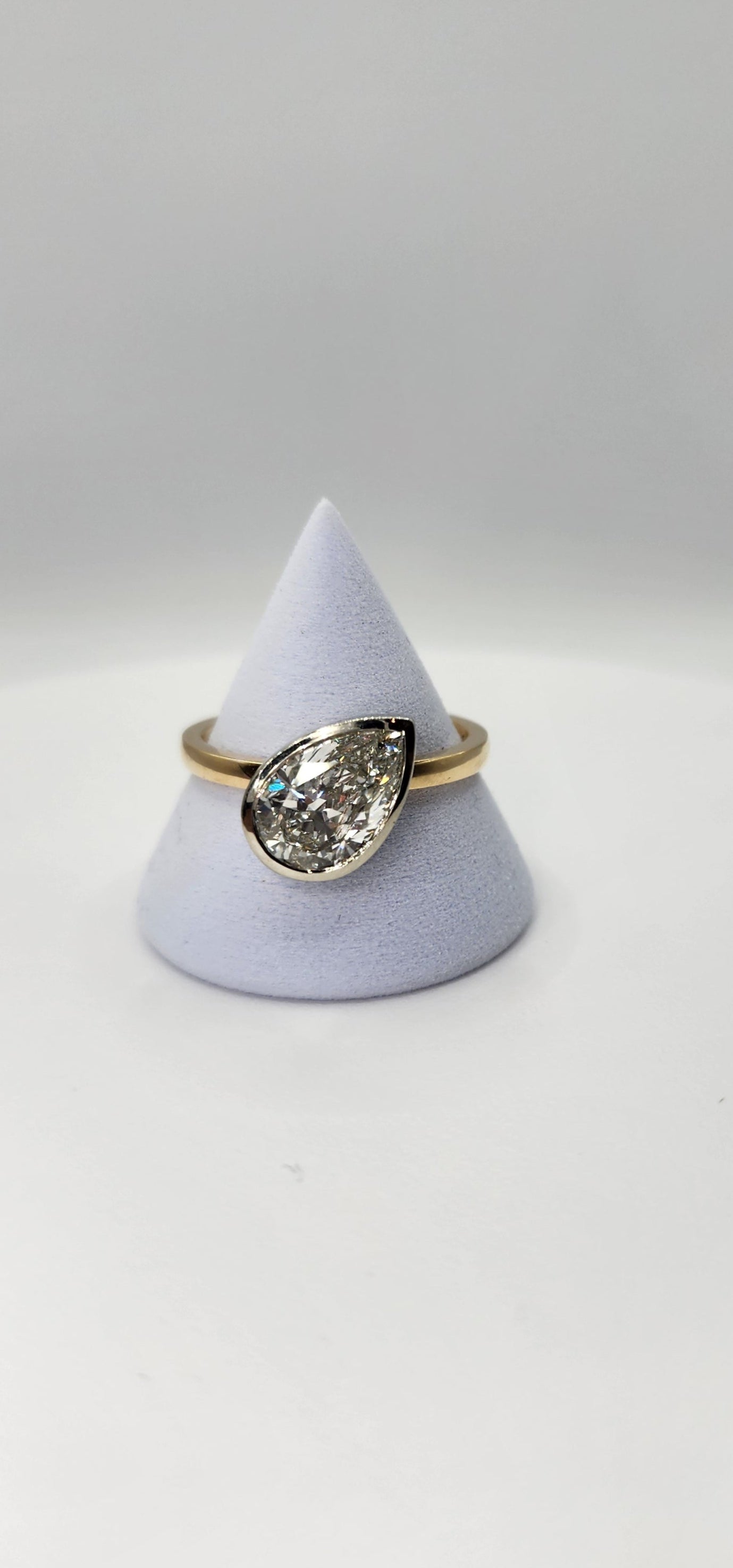 "The Kim Pear Bezel"  3 Carat Pear,  F, VS1 IGI Certified Lab Grown Diamond, set in a 14k White Gold Bezel Setting Head with a 14K Yellow Gold Band