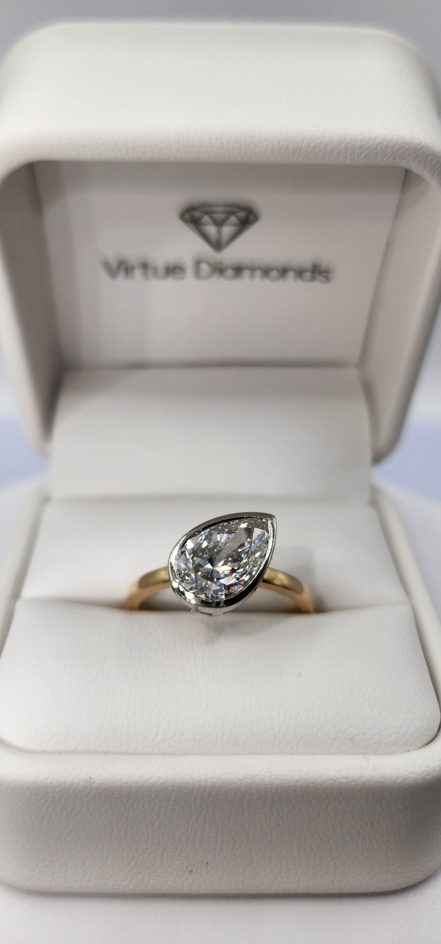 "The Kim Pear Bezel"  3 Carat Pear,  F, VS1 IGI Certified Lab Grown Diamond, set in a 14k White Gold Bezel Setting Head with a 14K Yellow Gold Band