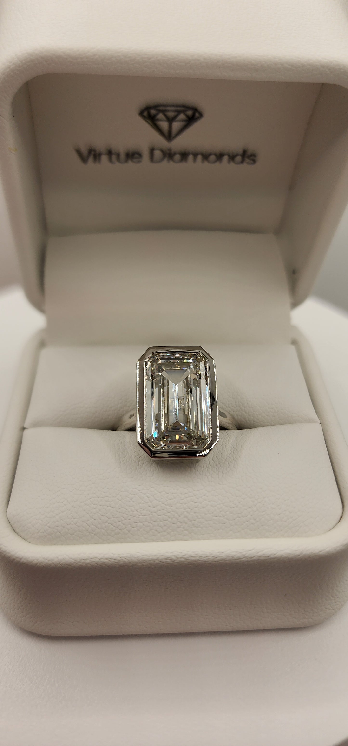 "The Paula" 8.11 Carat Emerald Cut Lab Grown Diamond Ring, IGI Certified F/VS1 in a Sleek Full Bezel Setting