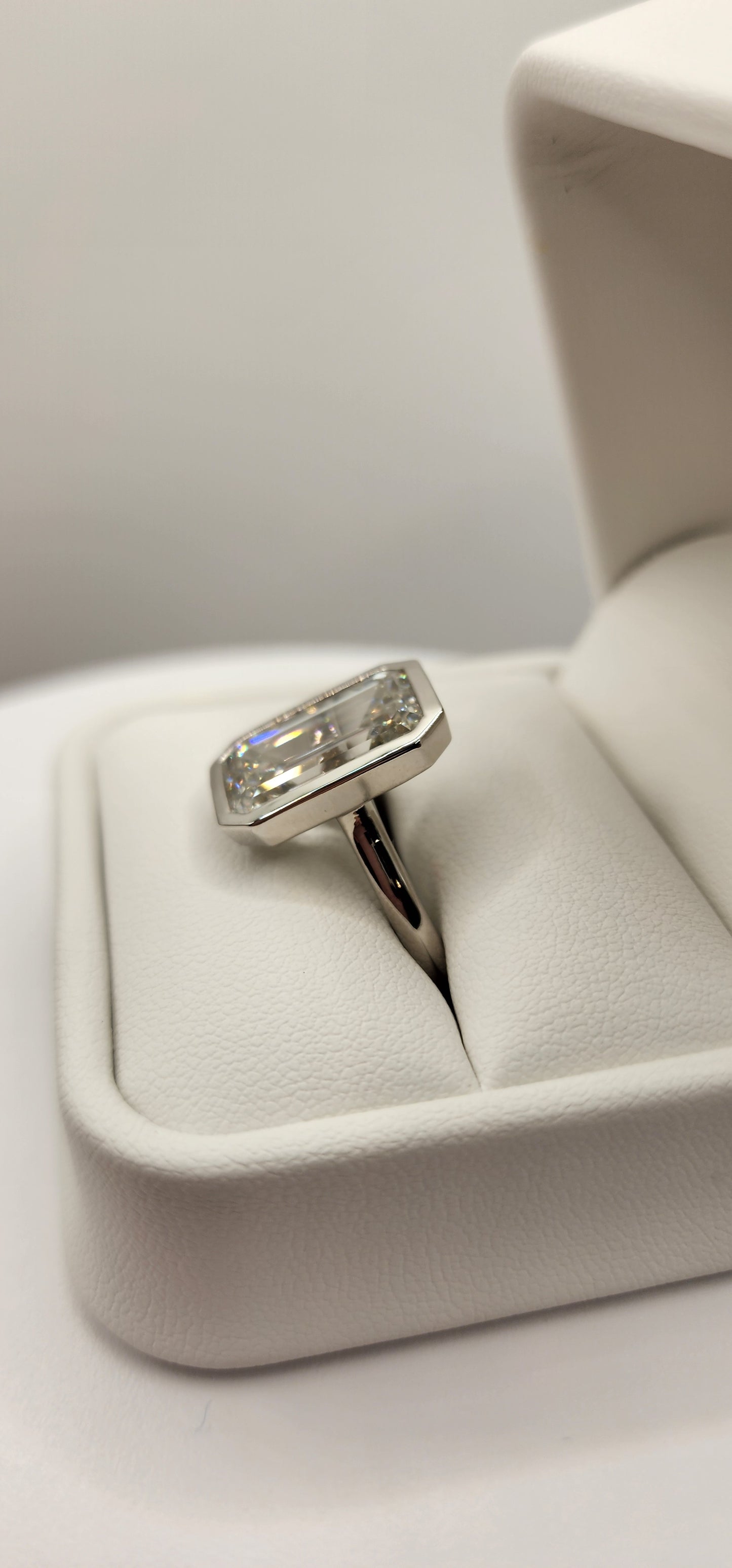 "The Paula" 8.11 Carat Emerald Cut Lab Grown Diamond Ring, IGI Certified F/VS1 in a Sleek Full Bezel Setting