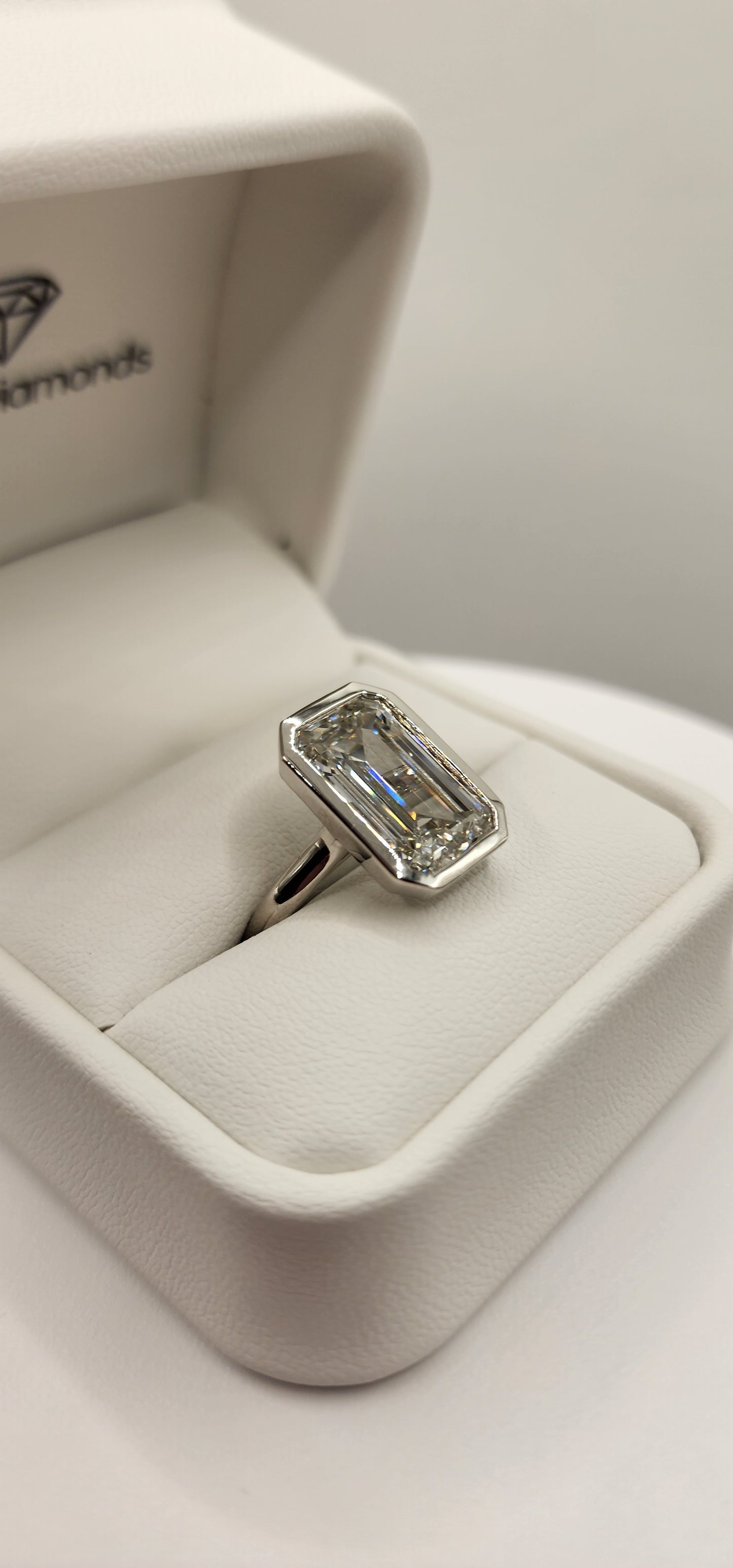 "The Paula" 8.11 Carat Emerald Cut Lab Grown Diamond Ring, IGI Certified F/VS1 in a Sleek Full Bezel Setting