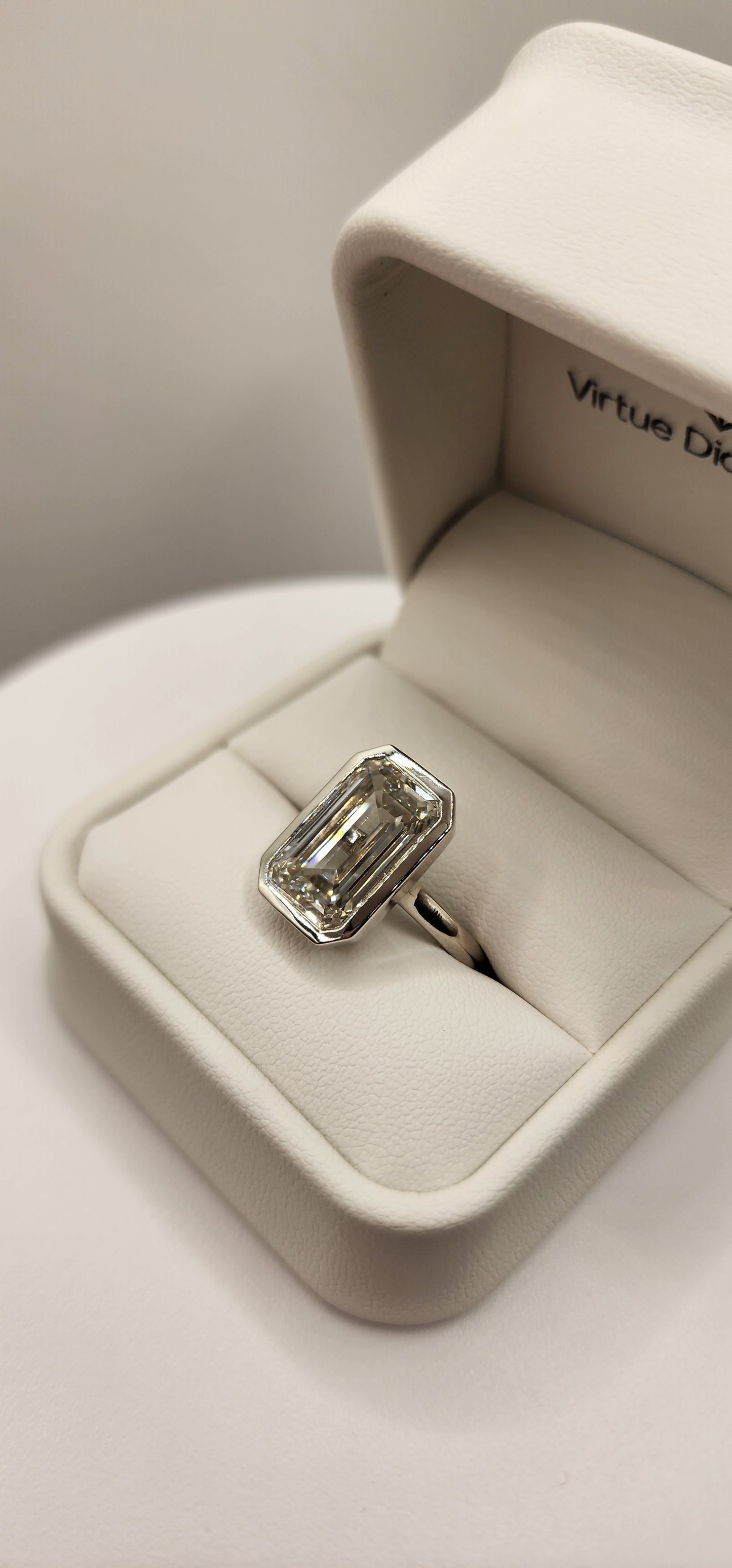 "The Paula" 8.11 Carat Emerald Cut Lab Grown Diamond Ring, IGI Certified F/VS1 in a Sleek Full Bezel Setting