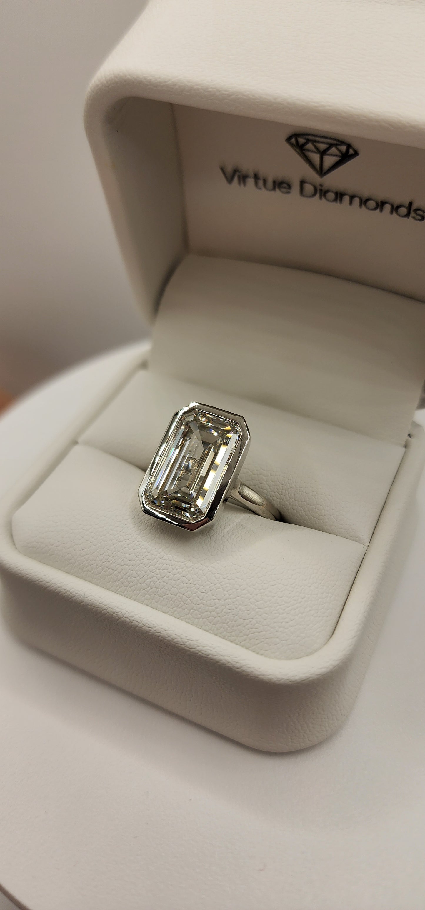 "The Paula" 8.11 Carat Emerald Cut Lab Grown Diamond Ring, IGI Certified F/VS1 in a Sleek Full Bezel Setting