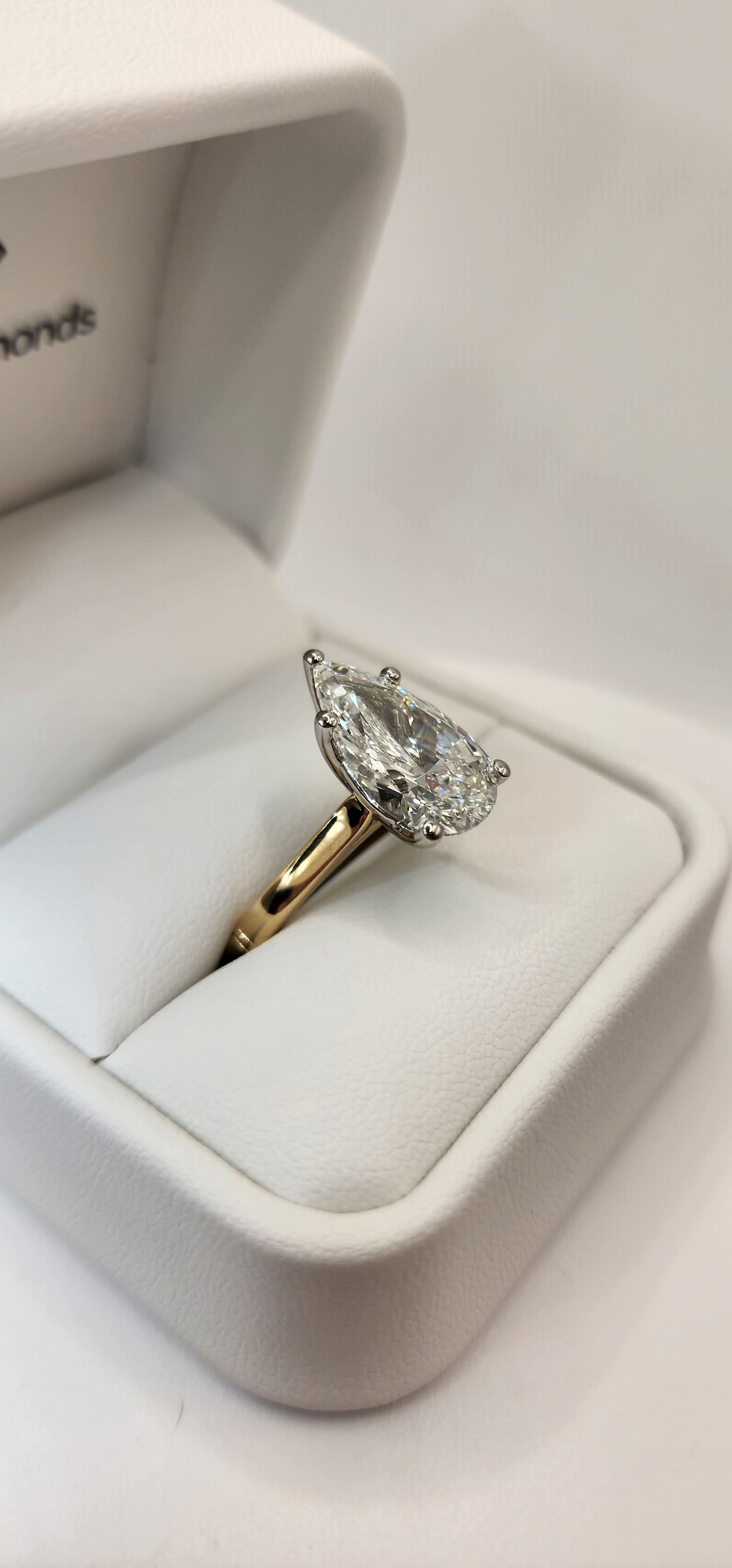 "The Dottie" is a 5.49 Carat Pear Lab Grown Diamond F/VS1 on a 14k Yellow Gold Cathedral Solitaire with 14k White Gold Prongs/Head