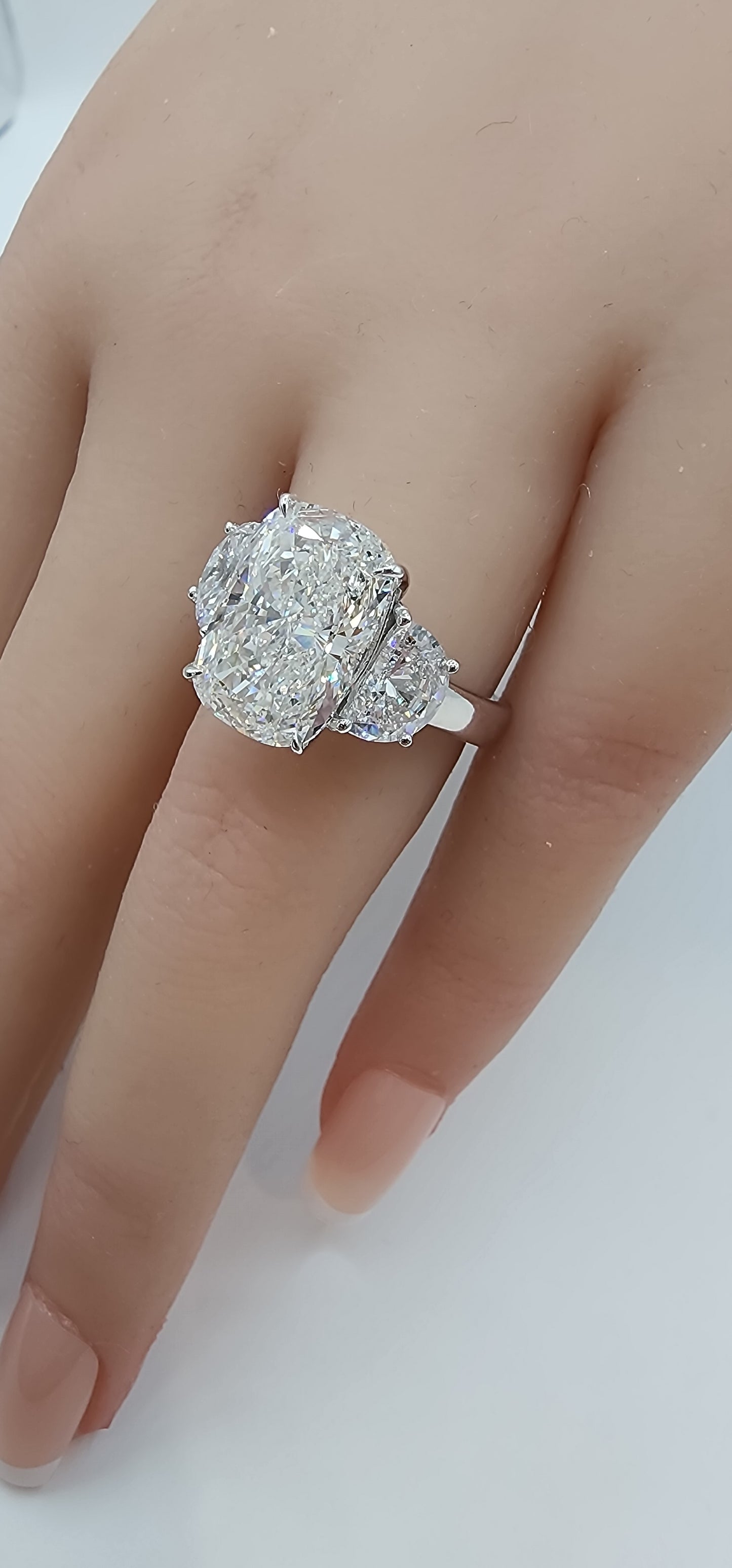 "The Diana" is a 5.51 Carat Elongated Cushion Lab Grown Diamond E/VS1 with 2 Half Moon Side Diamonds