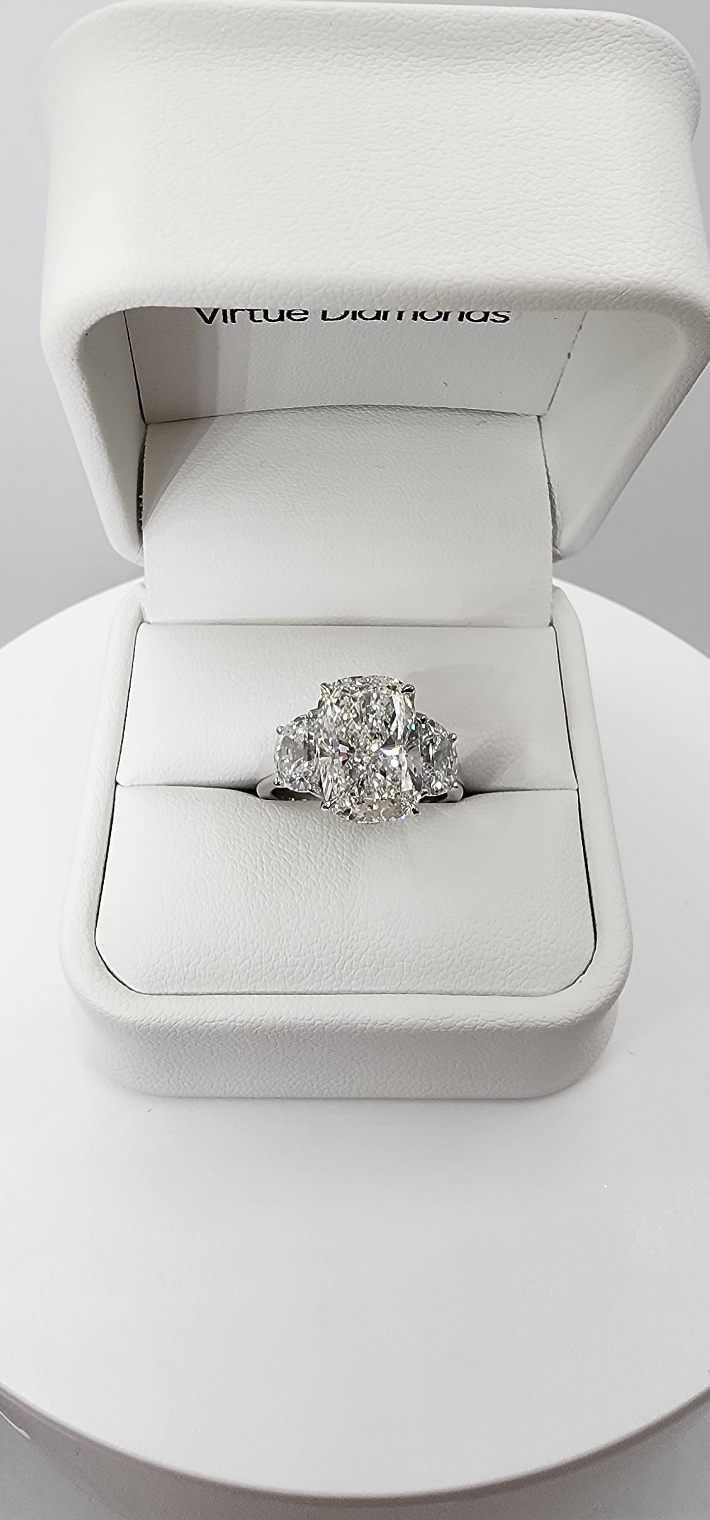 "The Diana" is a 5.51 Carat Elongated Cushion Lab Grown Diamond E/VS1 with 2 Half Moon Side Diamonds