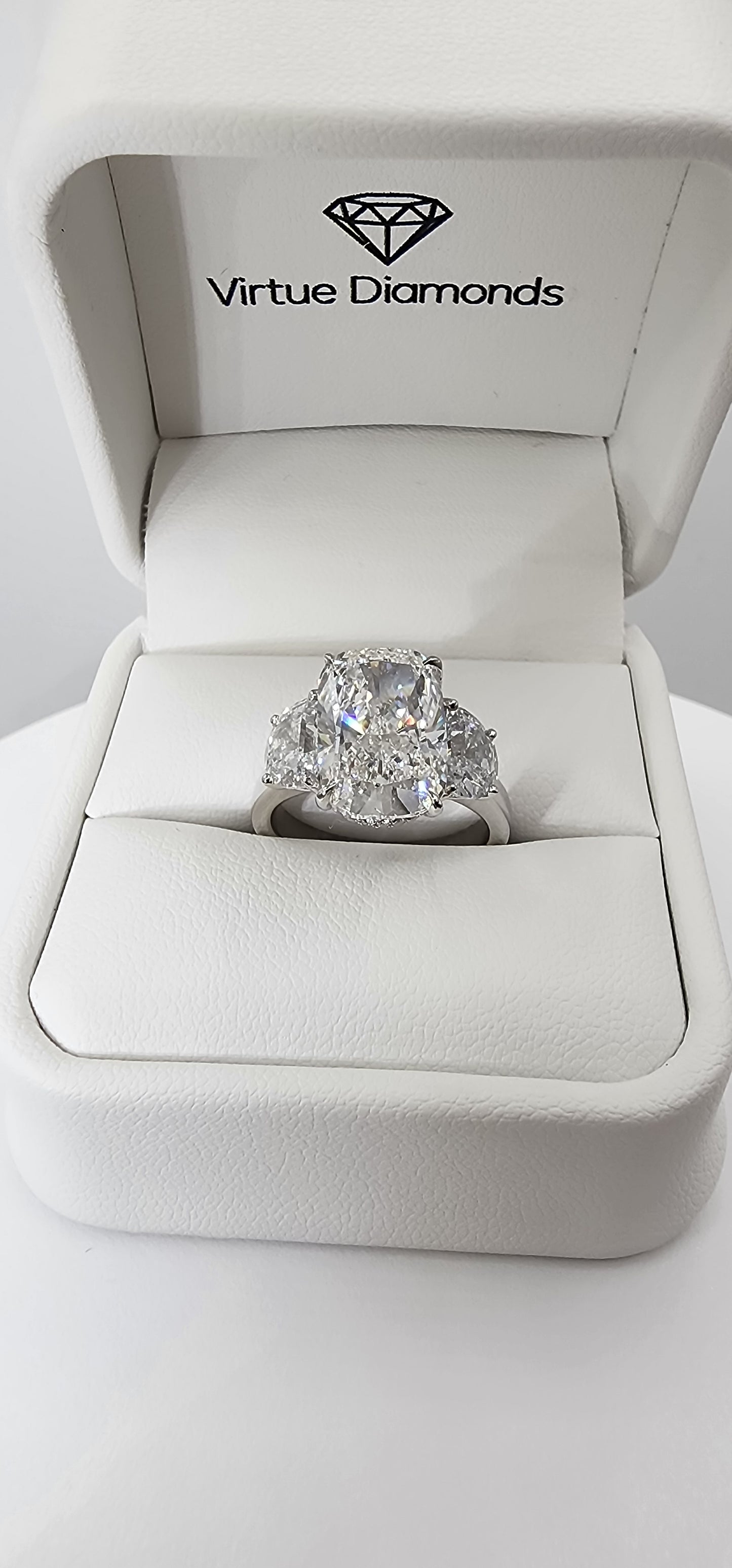 "The Diana" is a 5.51 Carat Elongated Cushion Lab Grown Diamond E/VS1 with 2 Half Moon Side Diamonds