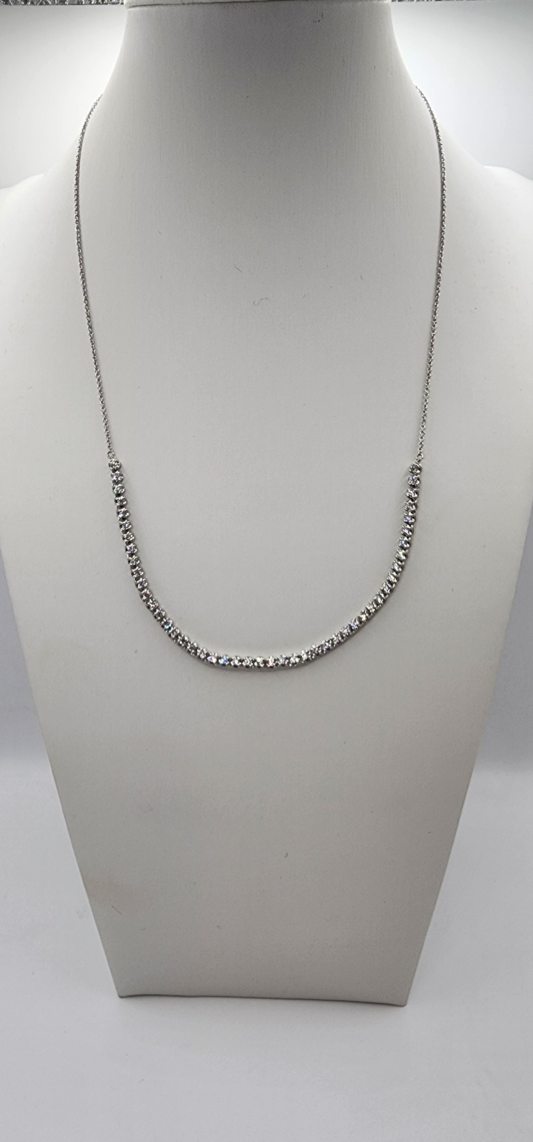 White Gold and Diamond necklace on a mannequin bust against a white background
