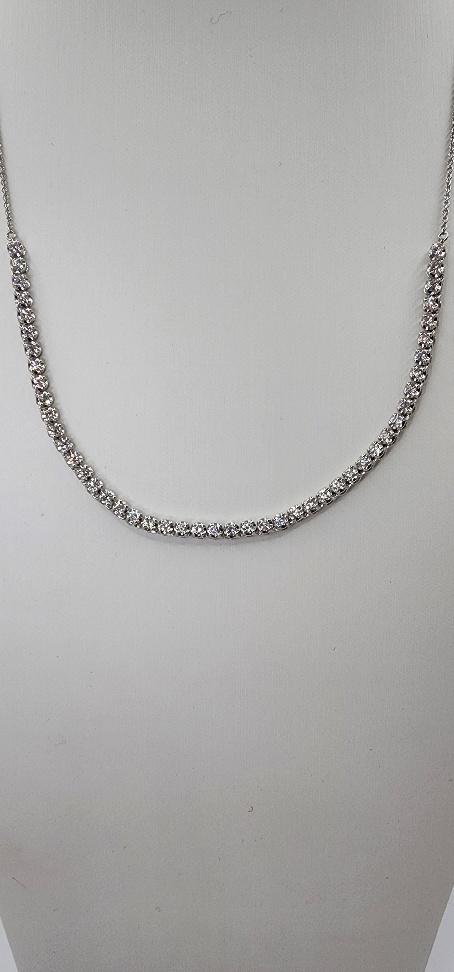 White Gold and Diamond necklace on a mannequin bust against a white background