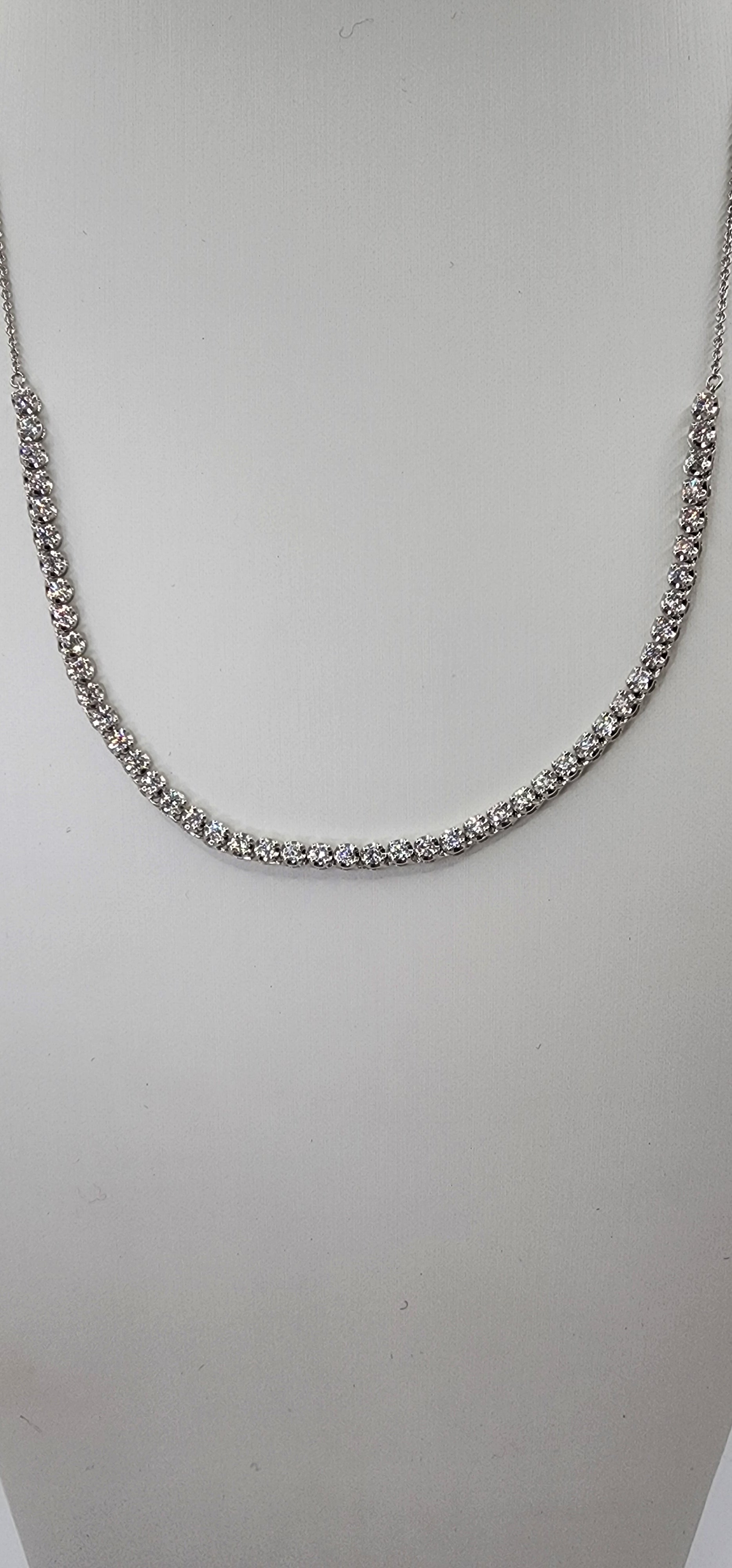 White Gold and Diamond necklace on a mannequin bust against a white background