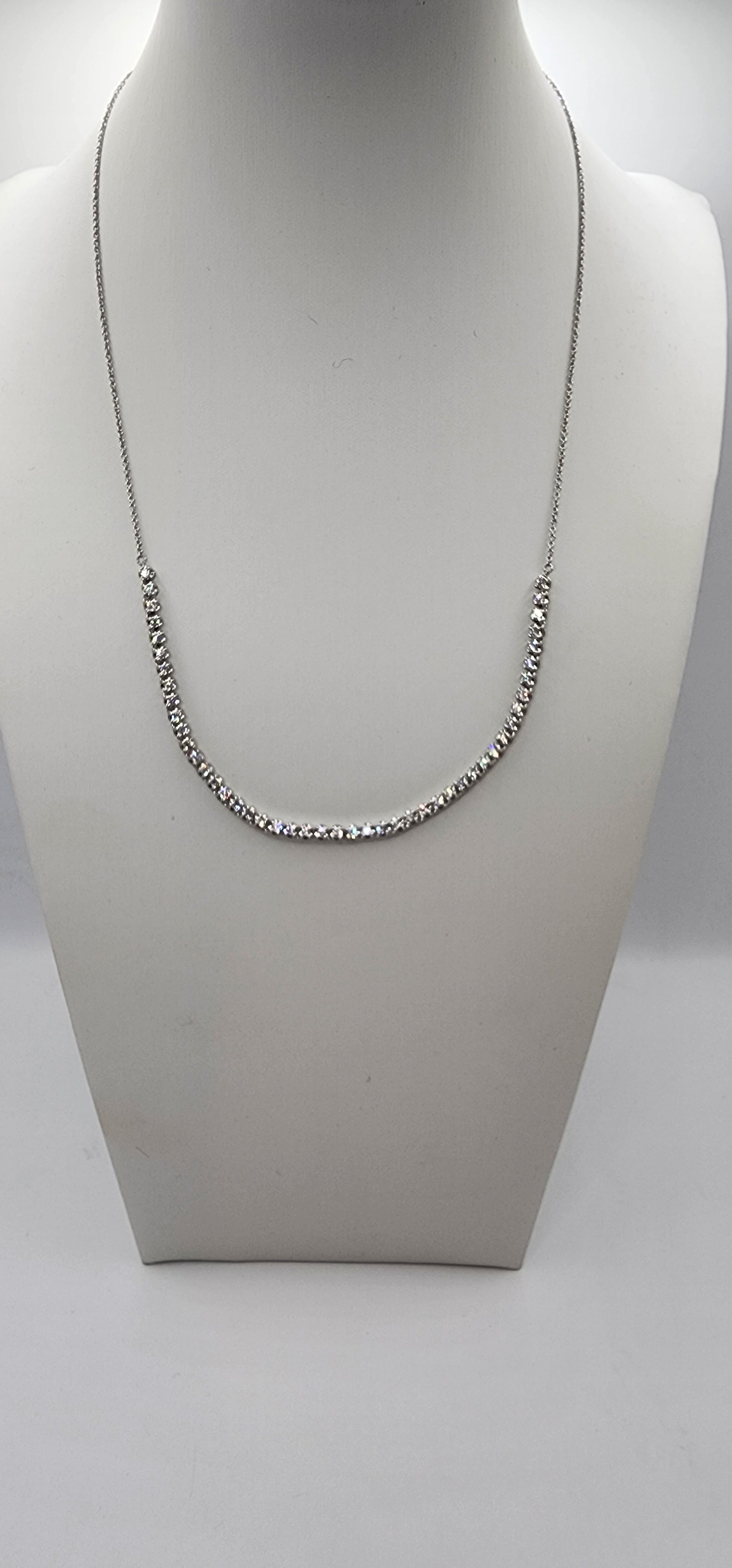 White Gold and Diamond necklace on a mannequin bust against a white background