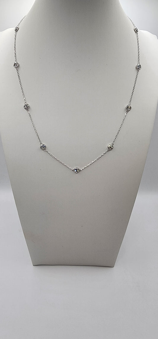 White Gold and Diamond Station Necklace on a mannequin bust against a white background