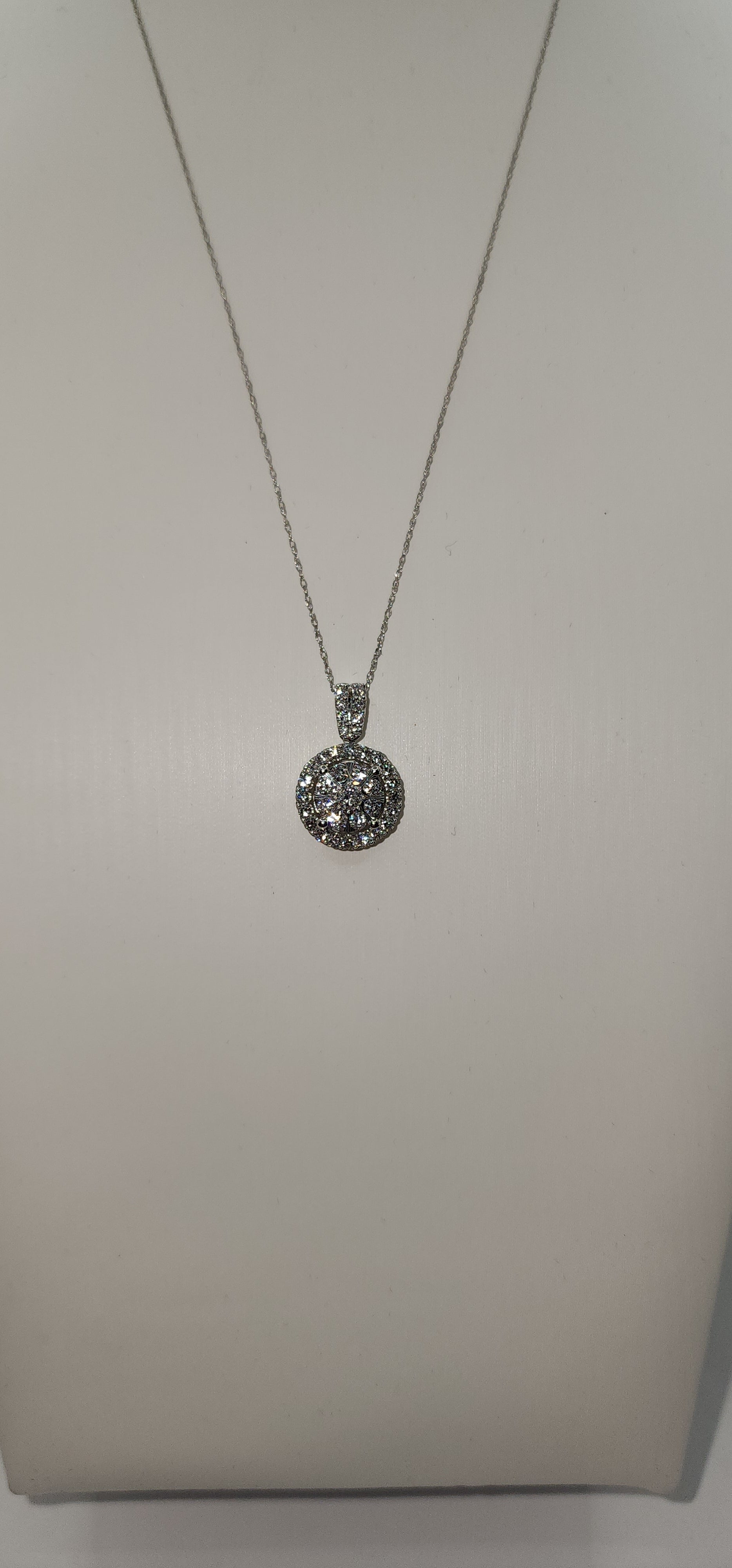 Silver necklace with a pendant on a white background