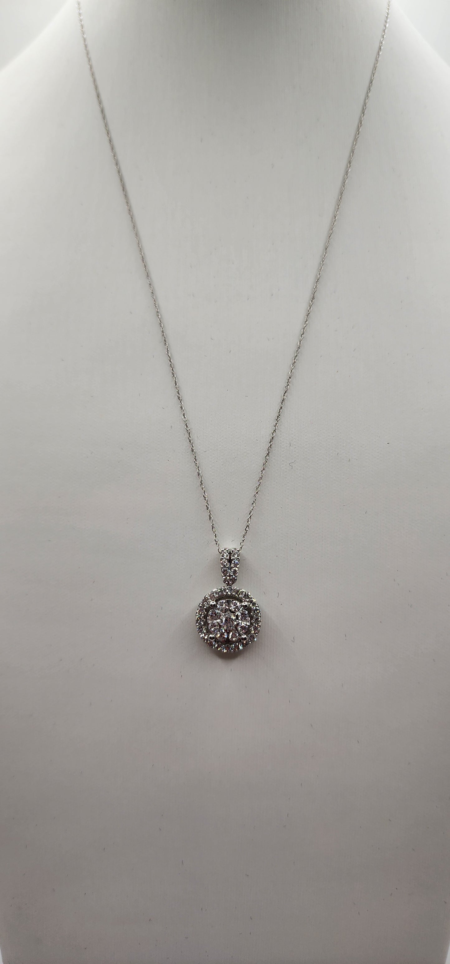 White Gold pendant on a necklace on a white background