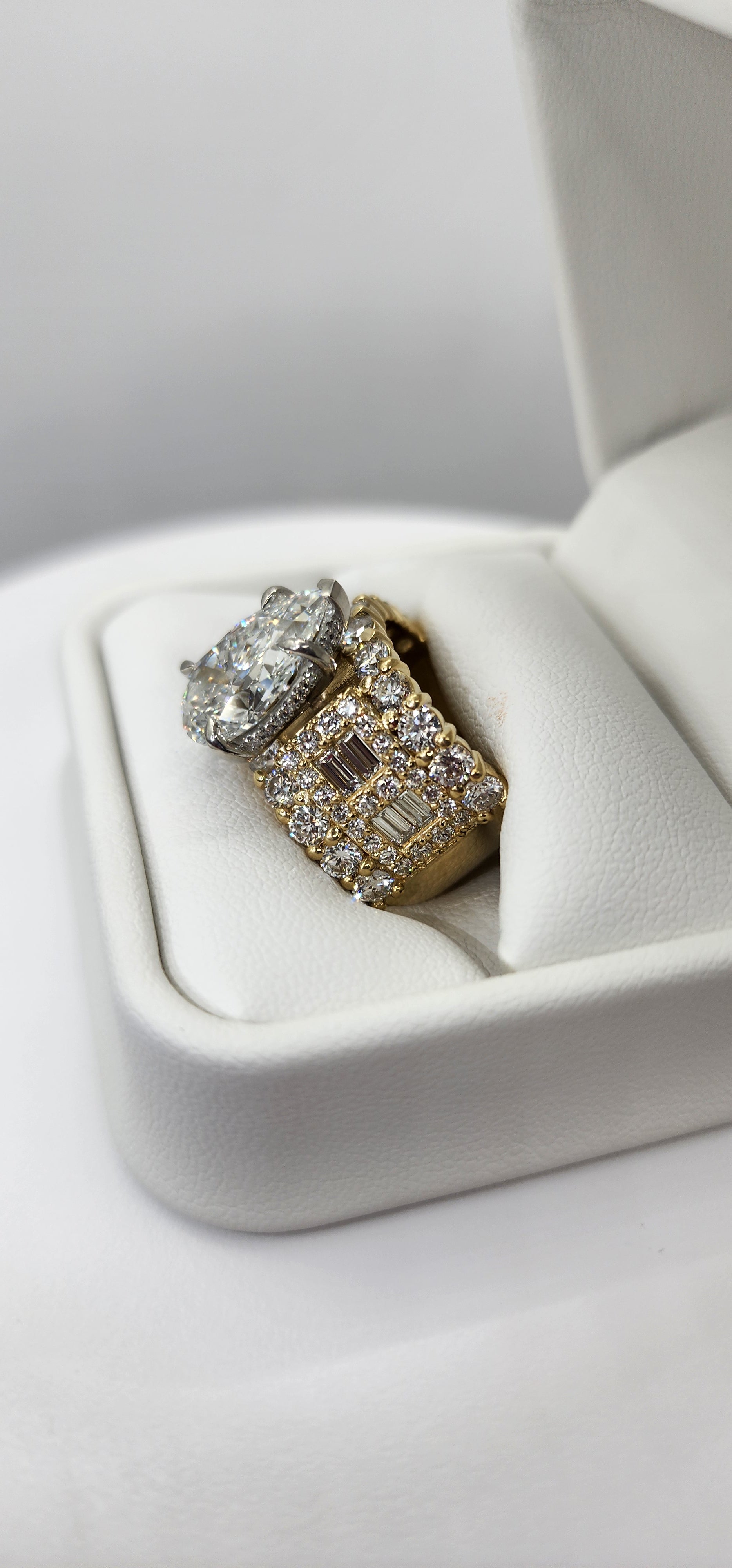 Pear diamond ring in a ring box against a white background
