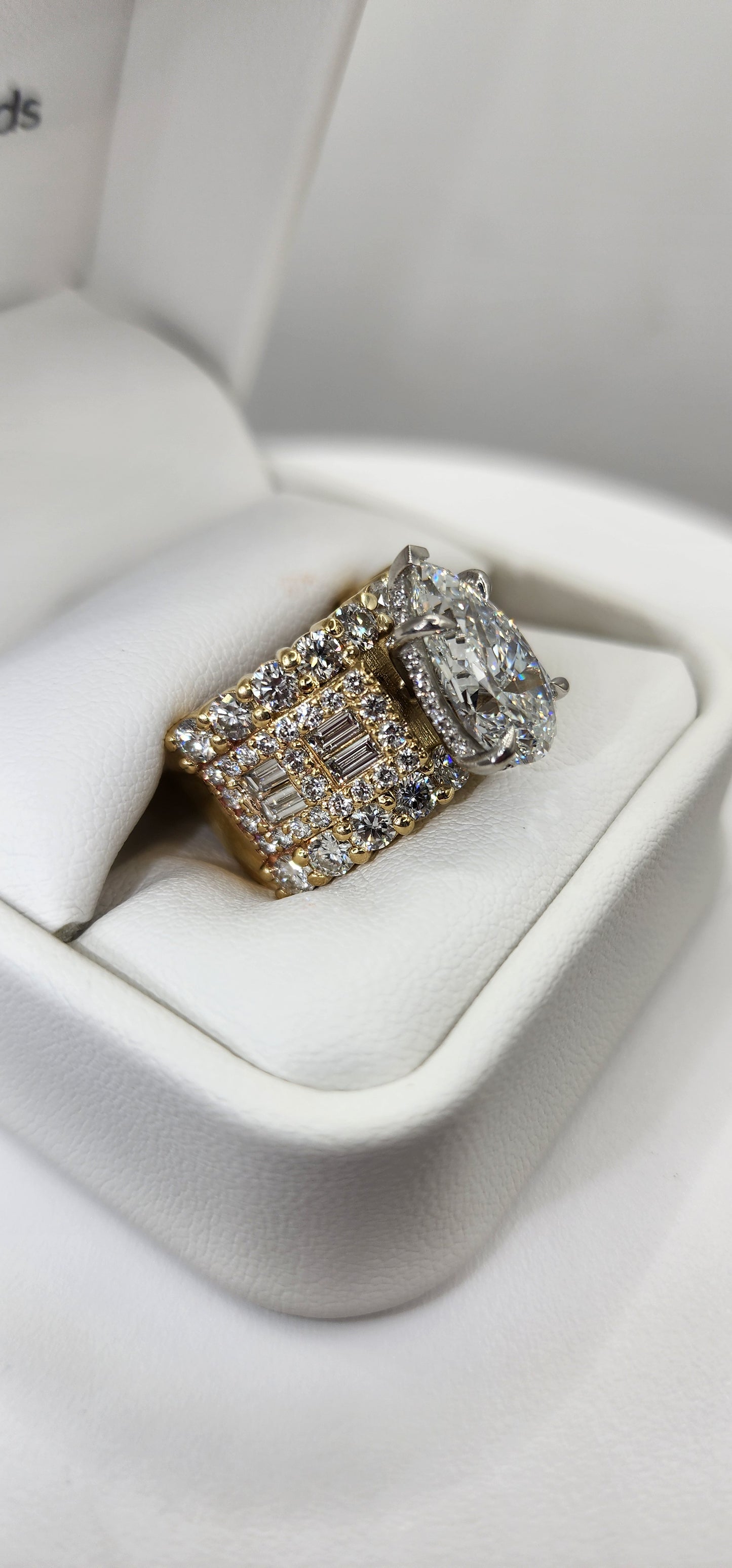 Pear diamond ring in a ring box against a white background