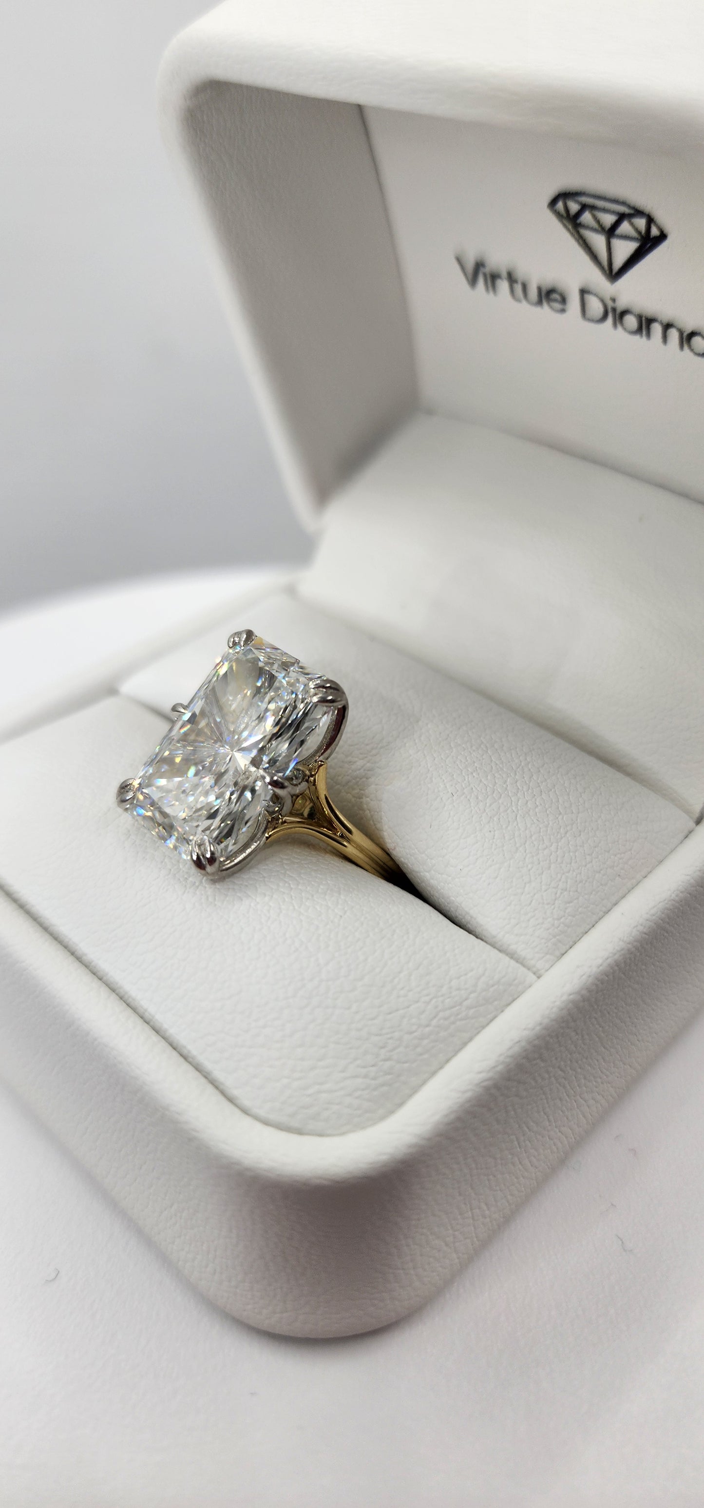 "The Lisa" is a 10 Carat Radiant Lab Grown Diamond on a 14k 2-tone Split Shank Solitaire