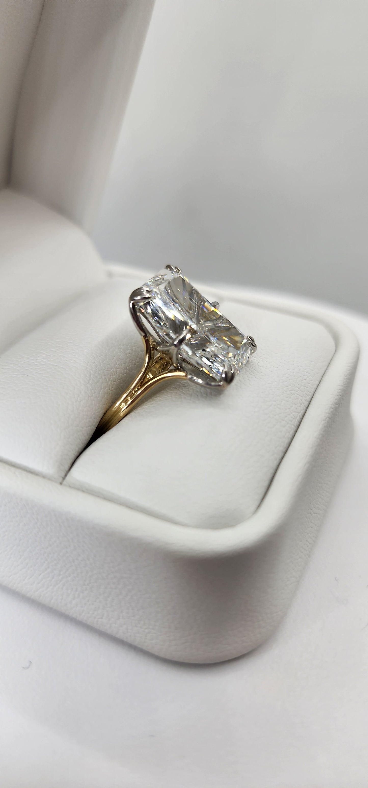 "The Lisa" is a 10 Carat Radiant Lab Grown Diamond on a 14k 2-tone Split Shank Solitaire