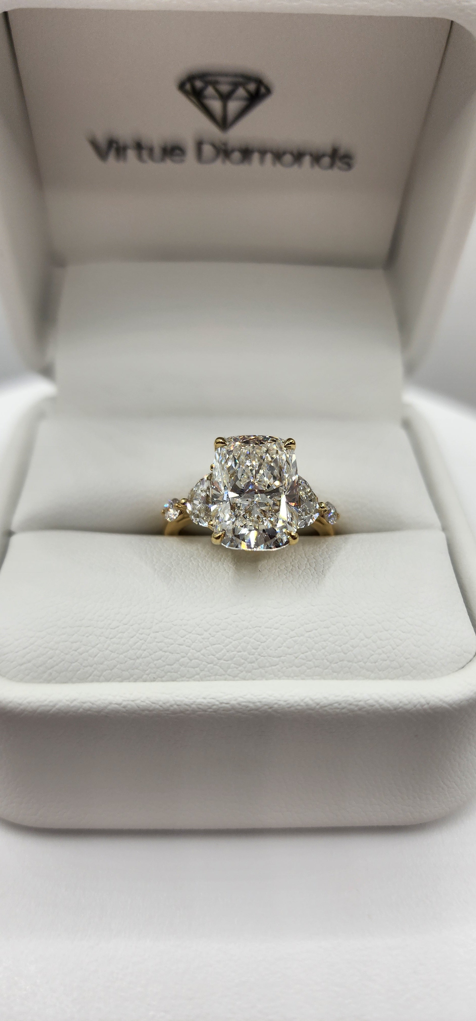 Diamond ring in a white box with 'Virtue Diamonds' branding.