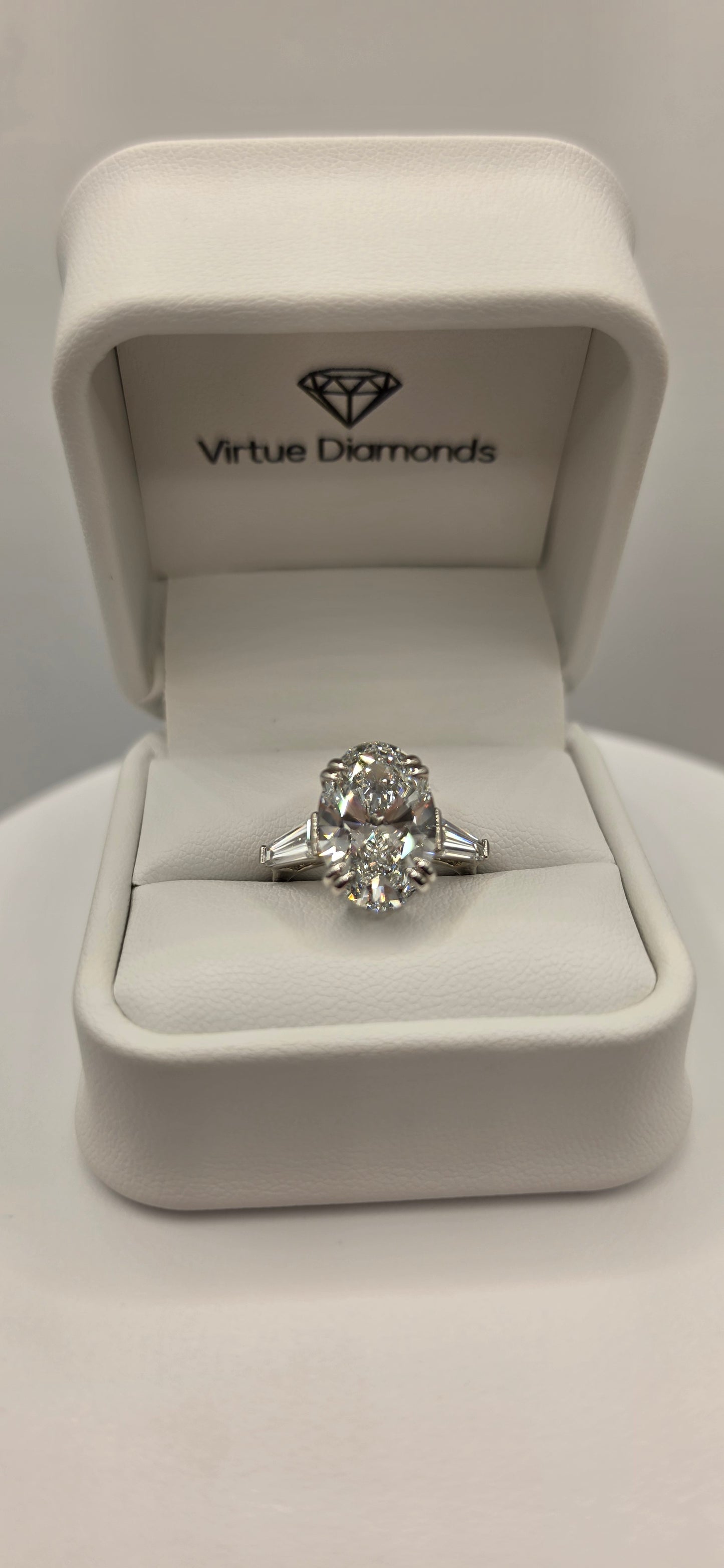 Diamond ring in a white jewelry box with 'Vivace Diamonds' branding.