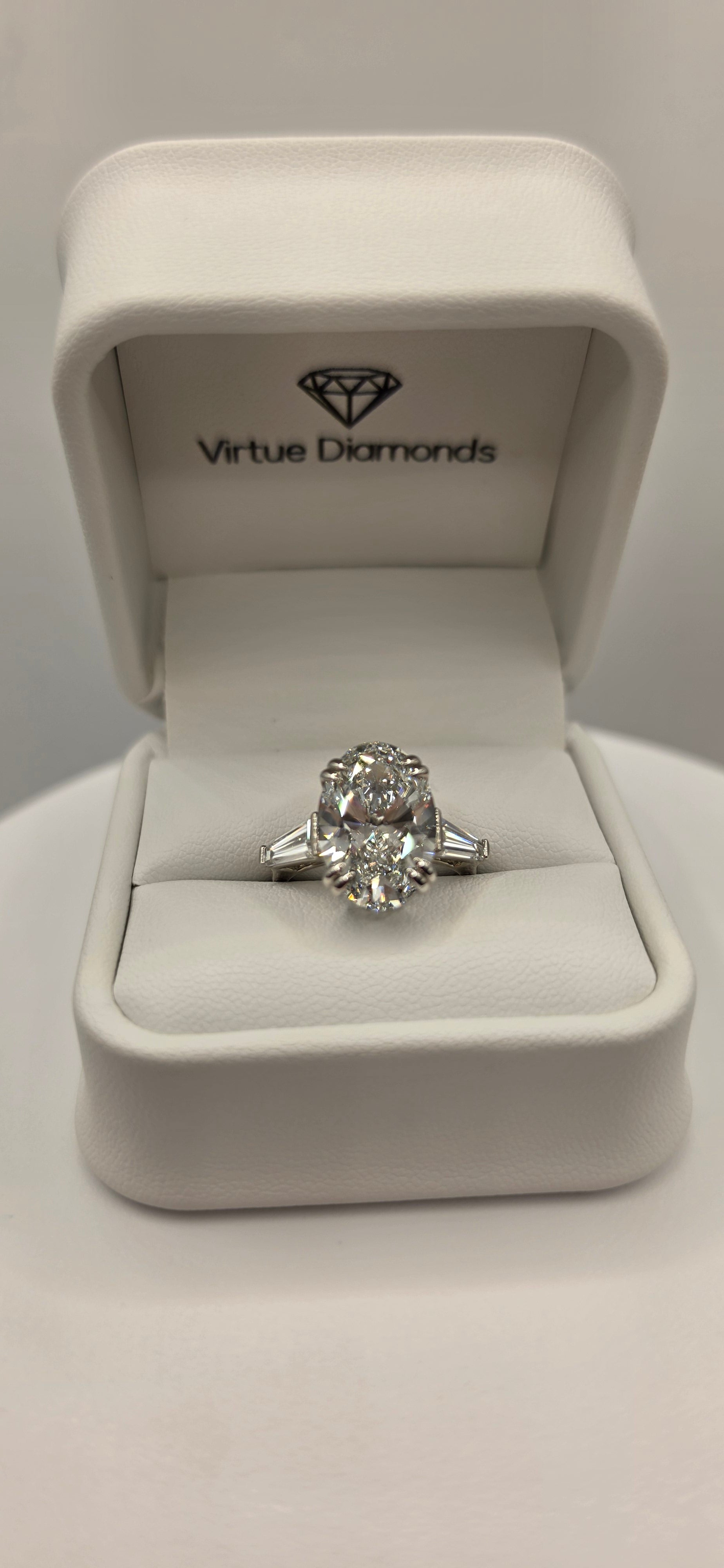 Diamond ring in a white jewelry box with 'Vivace Diamonds' branding.