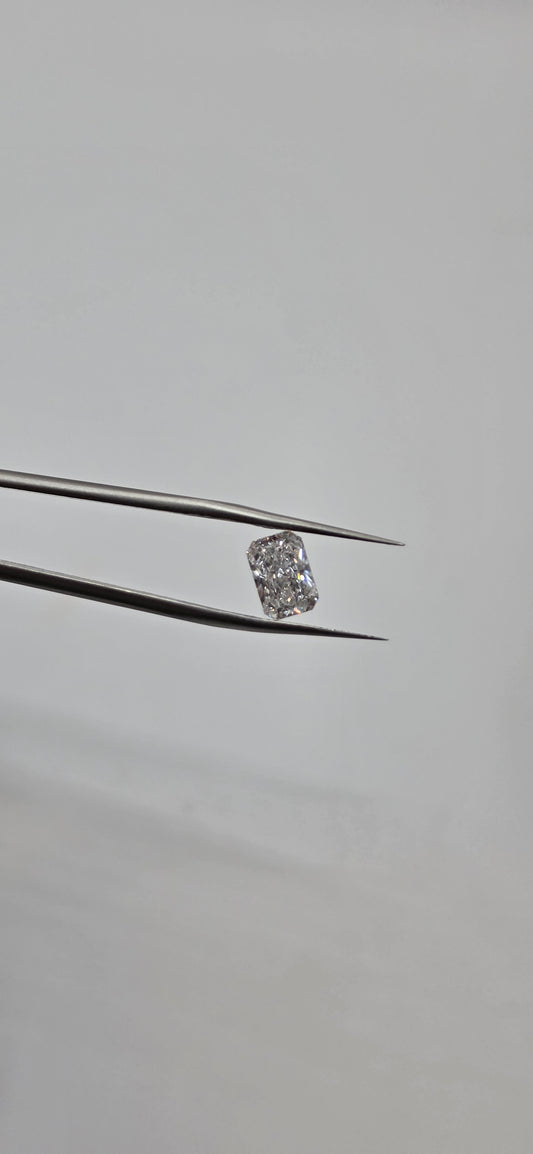 Diamond on a thin metal rod against a gray background