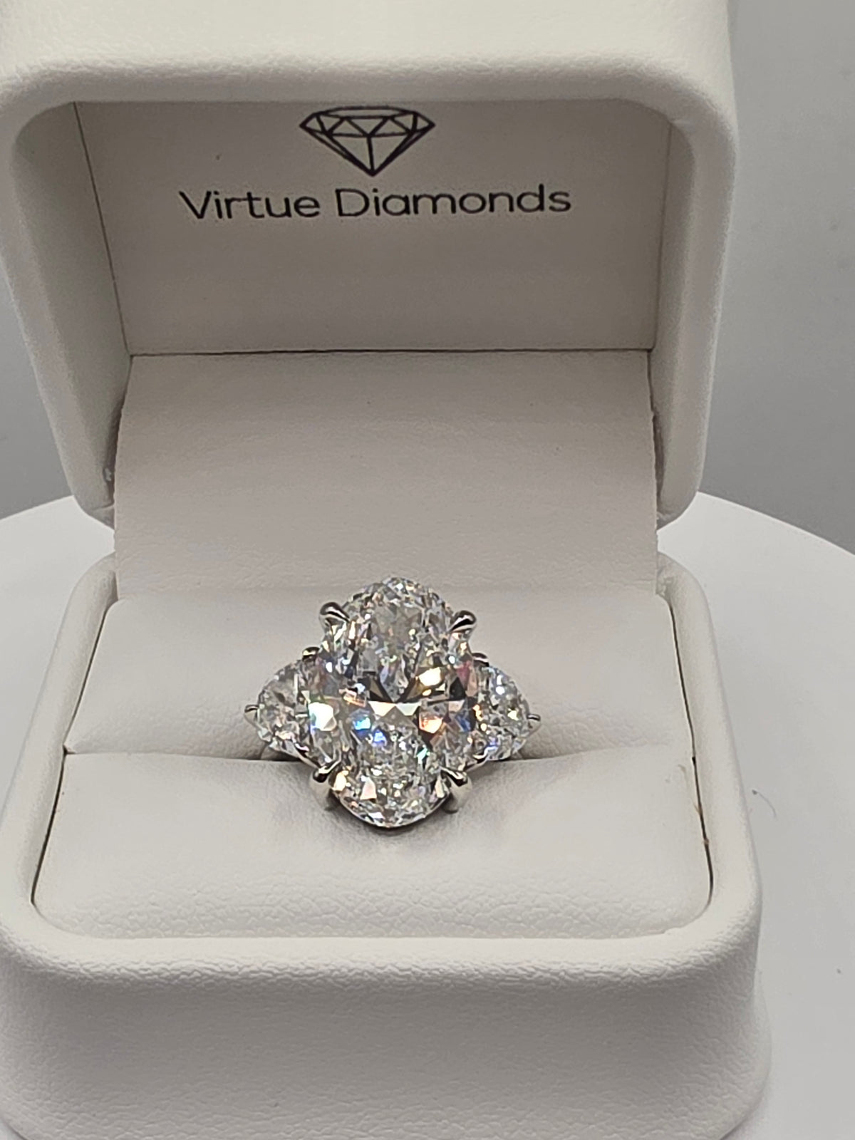 The Sopia a 10 Carat Oval Lab Diamond F/VVS2, IGI Certified w/1.6 cttw half moons in Platinum