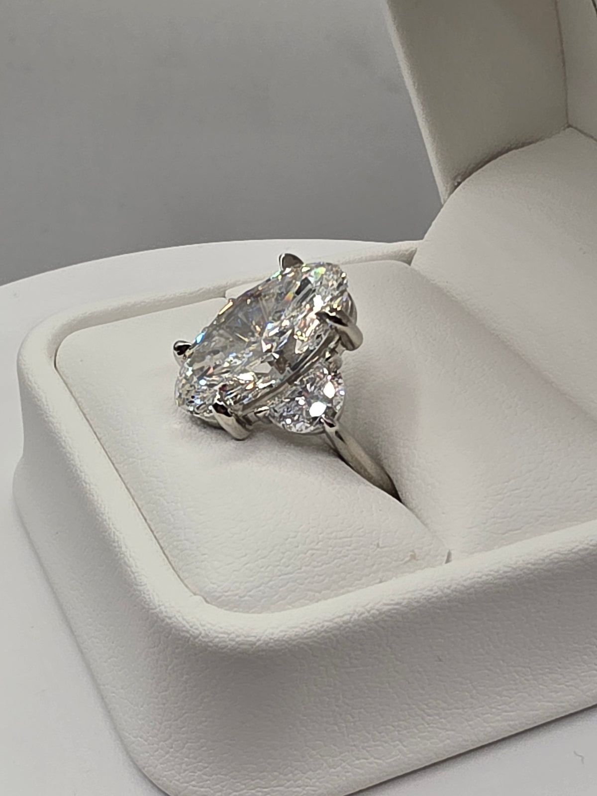 The Sopia a 10 Carat Oval Lab Diamond F/VVS2, IGI Certified w/1.6 cttw half moons in Platinum