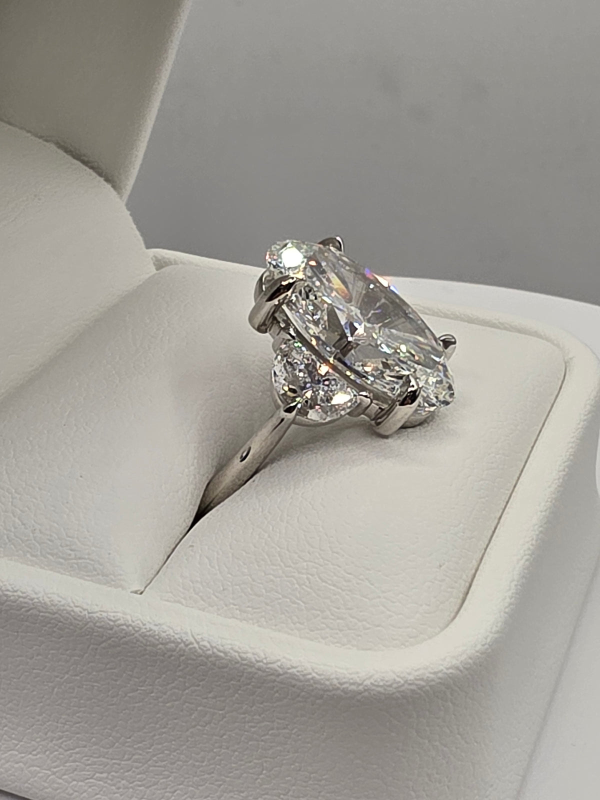 The Sopia a 10 Carat Oval Lab Diamond F/VVS2, IGI Certified w/1.6 cttw half moons in Platinum
