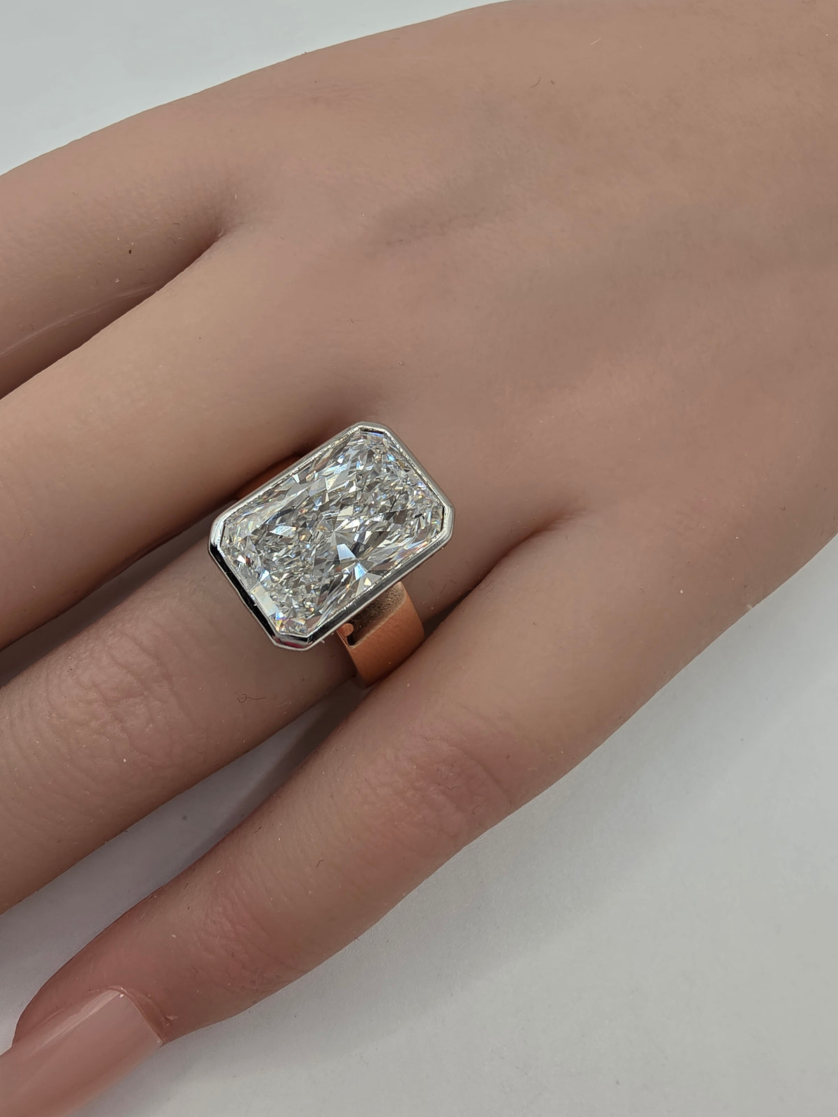 Diamond ring on a hand by white background