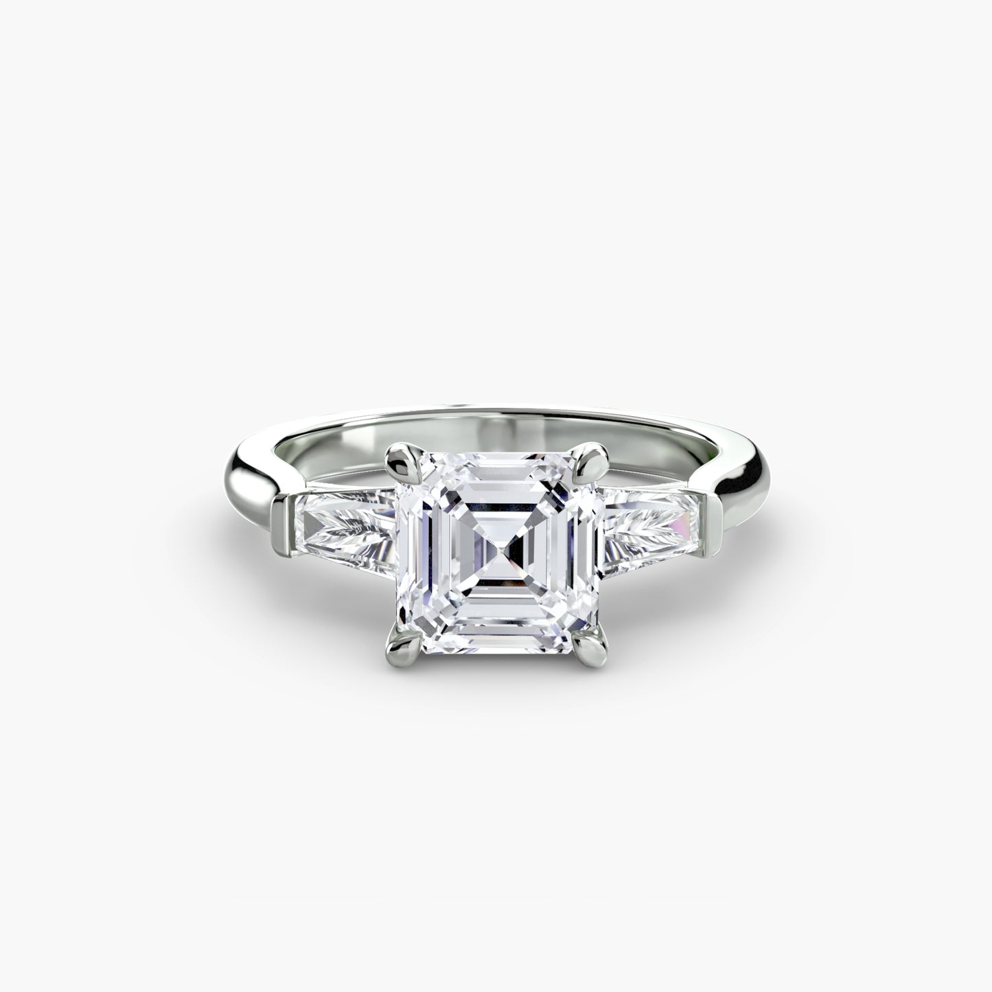 The "Oswego" Three-Stone Ring (Baguette Side Stones)
