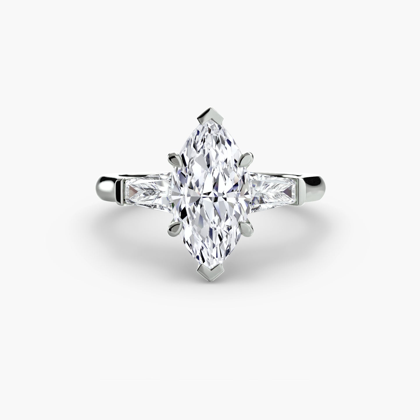 The "Oswego" Three-Stone Ring (Baguette Side Stones)