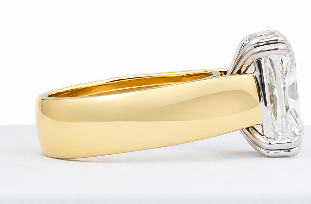 Gold and diamond ring on a white background
