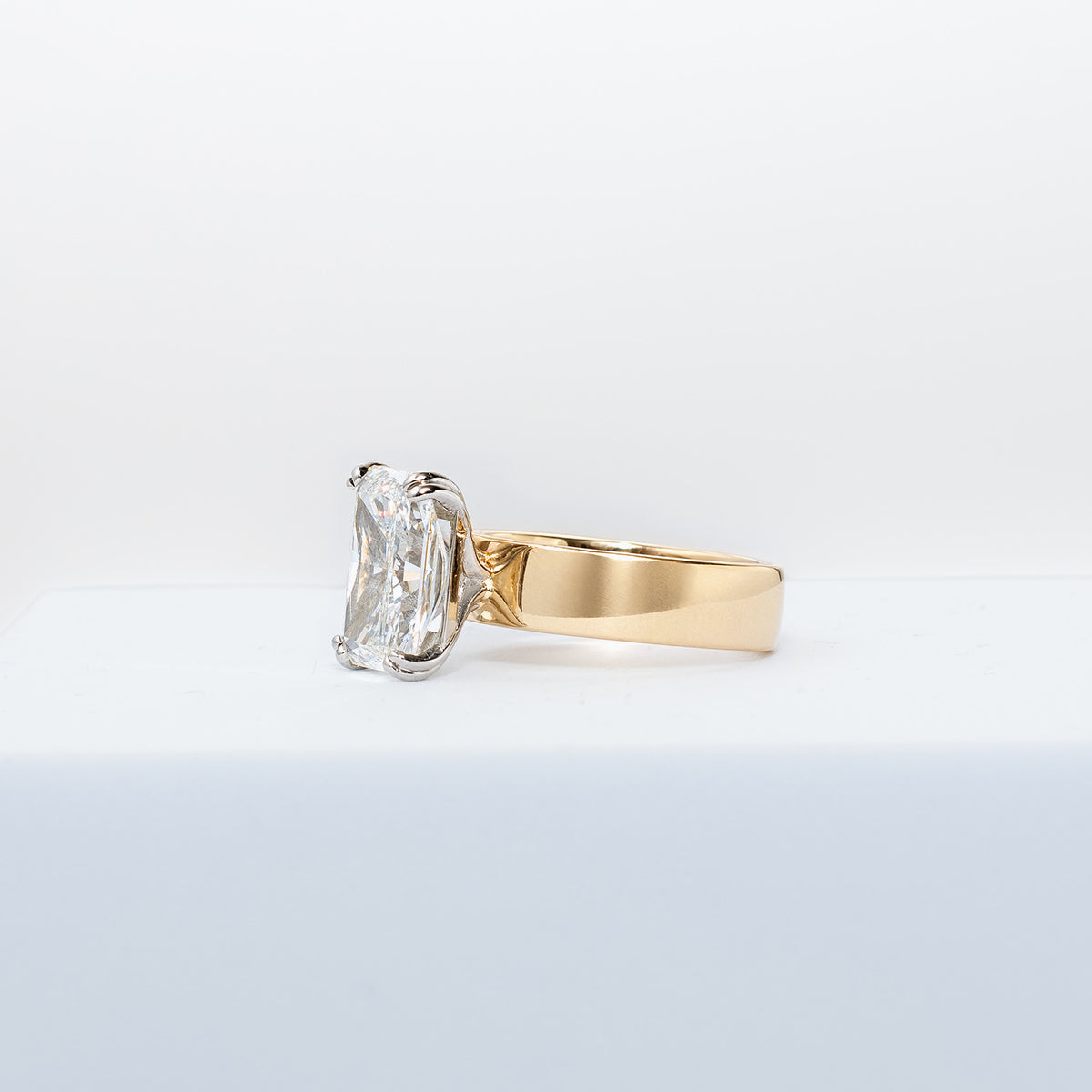 Gold and diamond ring on a white background