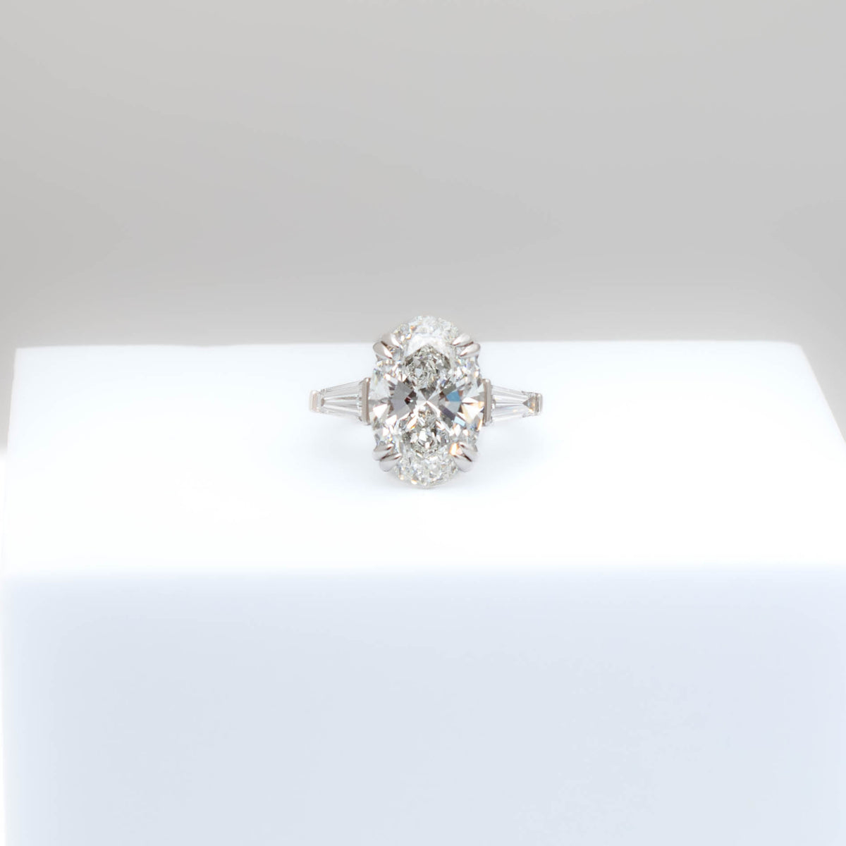 Gold and diamond ring on a white background