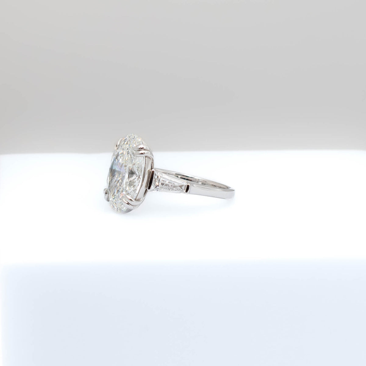 Gold and diamond ring on a white background